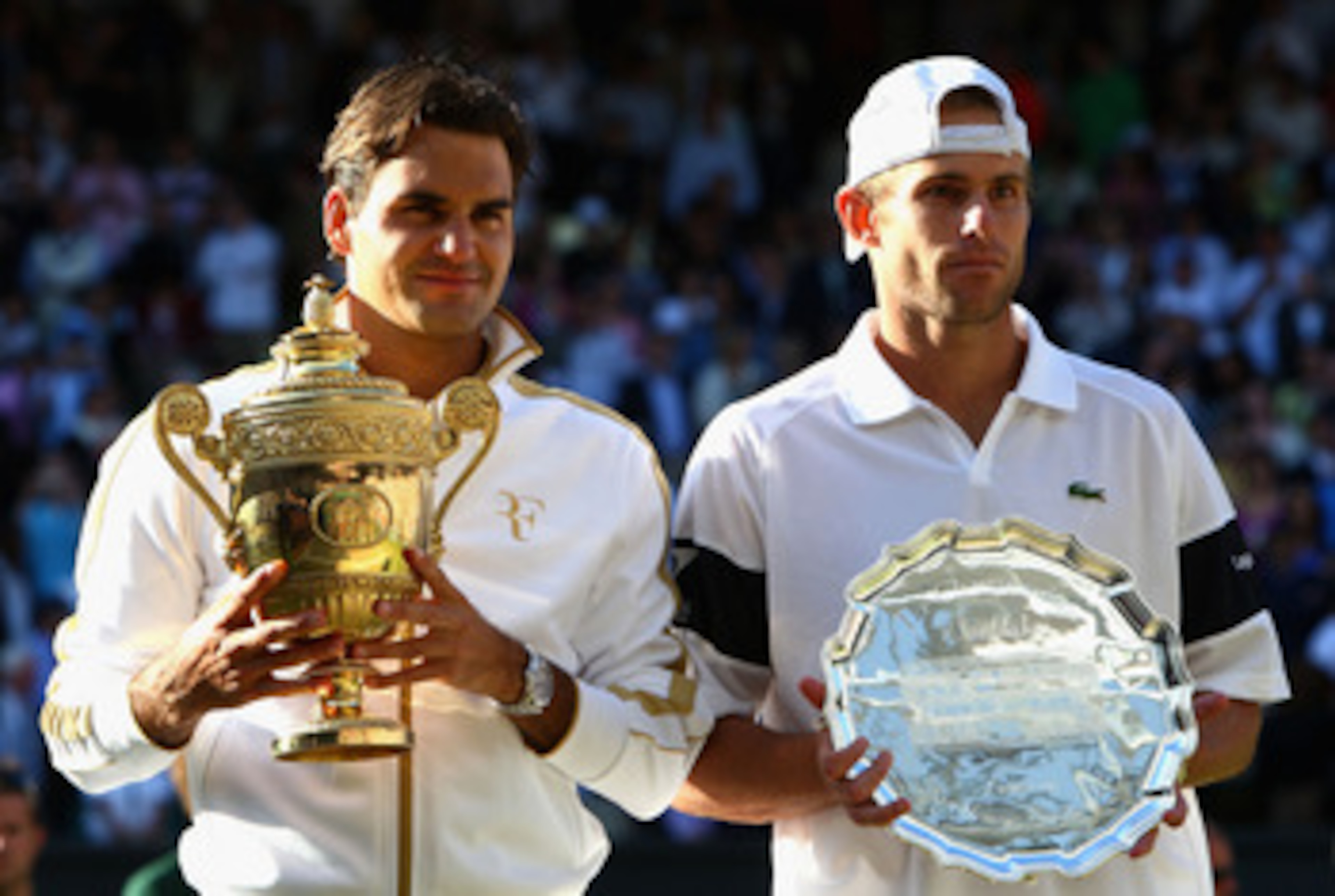 WIMBLEDON, ENGLAND - JULY 05: Roger Federer of Switzerland and Andy Roddick of USA pose for photographers after the men's singles final match against on Day Thirteen of the Wimbledon Lawn Tennis Championships at the All England Lawn Tennis and Croquet C WIMBLEDON, ENGLAND - JULY 05: Roger Federer of Switzerland and Andy Roddick of USA pose for photographers after the men's singles final match against on Day Thirteen of the Wimbledon Lawn Tennis Championships at the All England Lawn Tennis and Croquet C