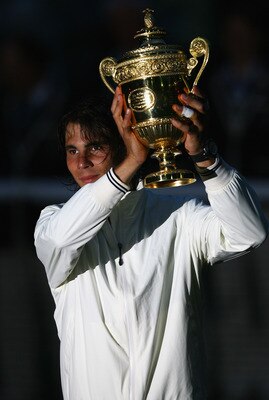 LONDON - JULY 06:  Rafael Nadal of Spain lifts the trophy after defeating Roger Federer of Switzerland in five sets in the final on day thirteen of the Wimbledon Lawn Tennis Championships at the All England Lawn Tennis and Croquet Club on July 6, 2008 in