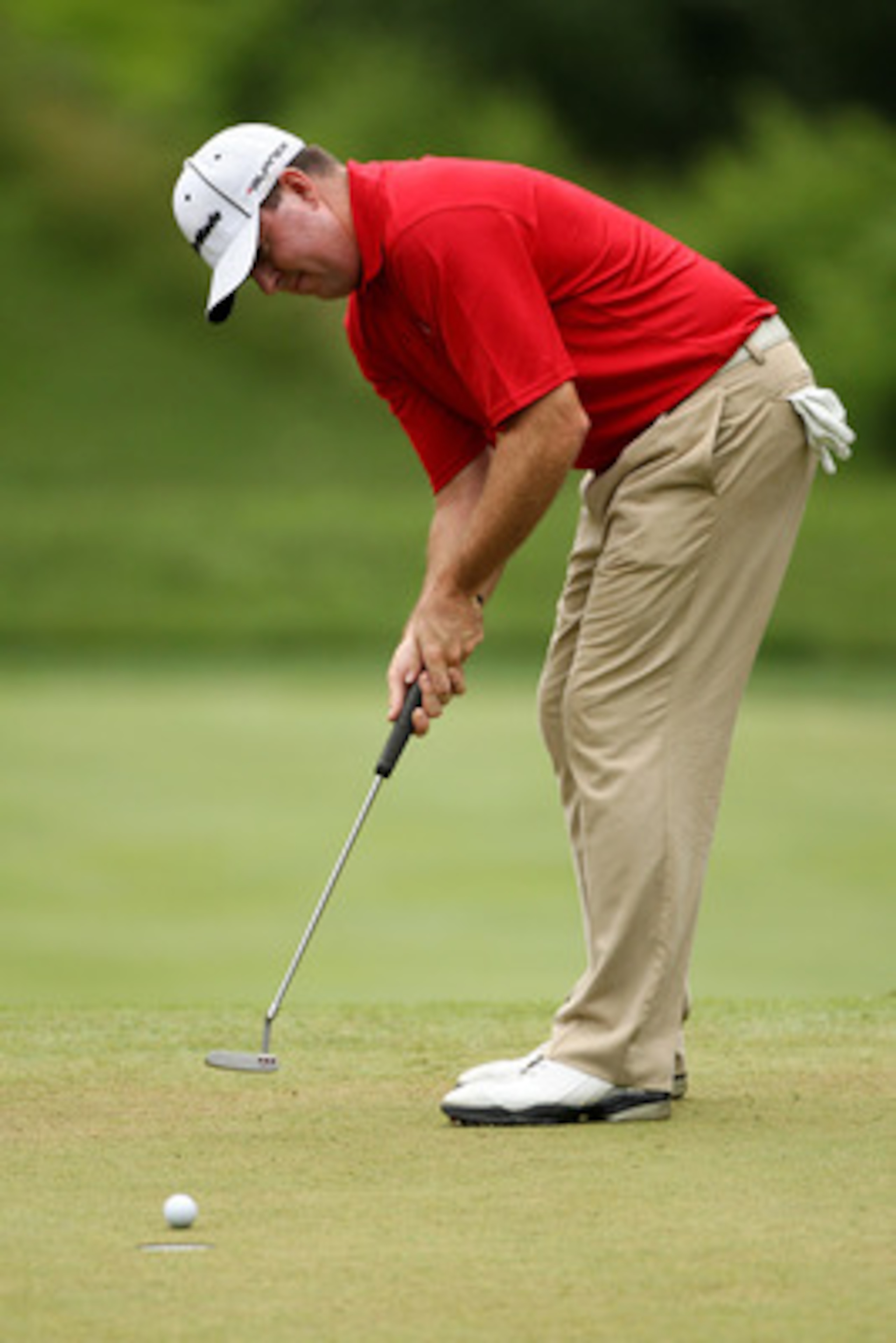 BETHESDA, MD - JUNE 18:  Robert Garrigus hits a putt on the 13th green during the third round of the 111th U.S. Open at Congressional Country Club on June 18, 2011 in Bethesda, Maryland.  (Photo by Andrew Redington/Getty Images)