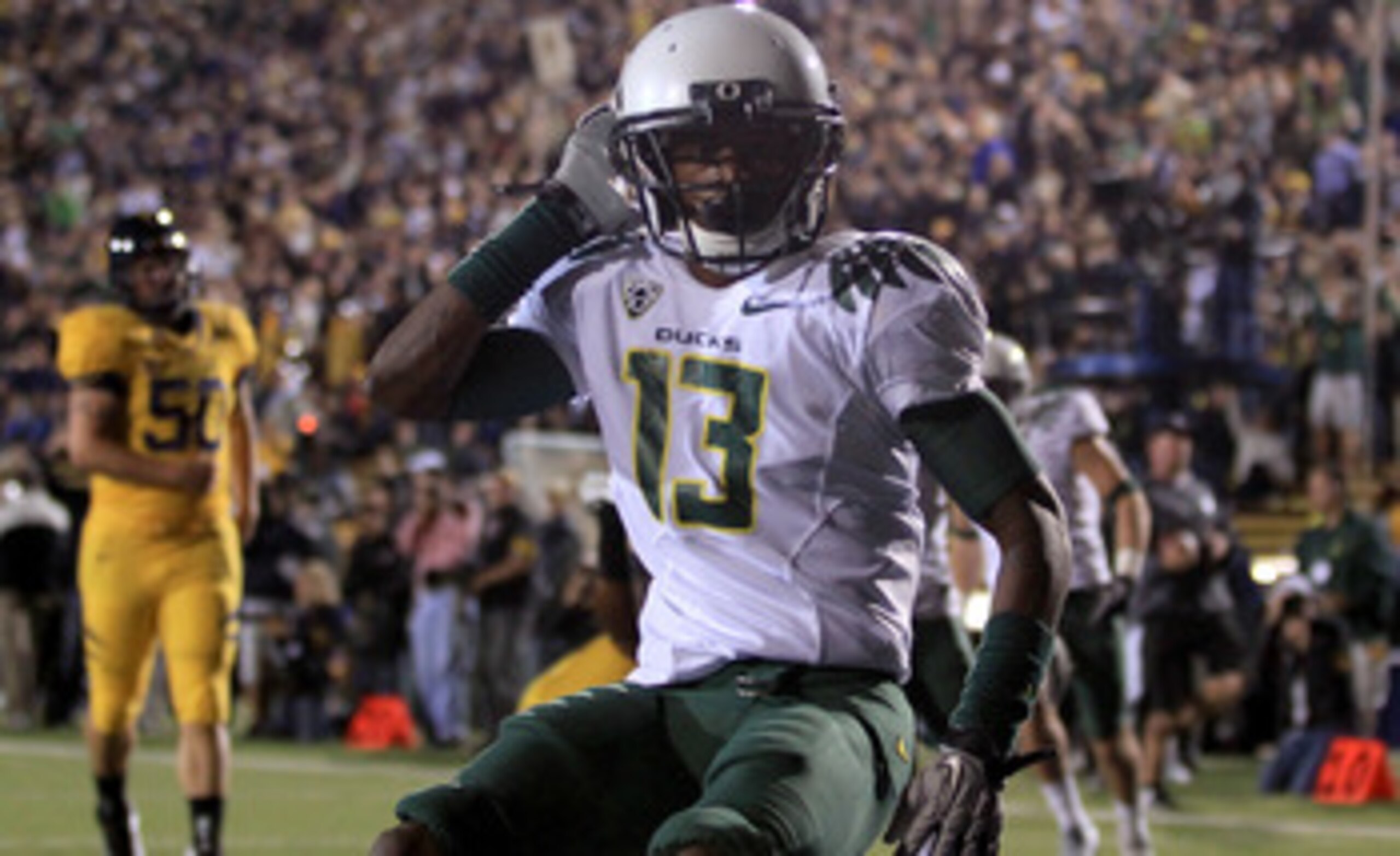 BERKELEY, CA - NOVEMBER 13:  Cliff Harris #13 of the Oregon Ducks celebrates after he returned a punt for a touchdown against the California Golden Bears  at California Memorial Stadium on November 13, 2010 in Berkeley, California.  (Photo by Ezra Shaw/Ge