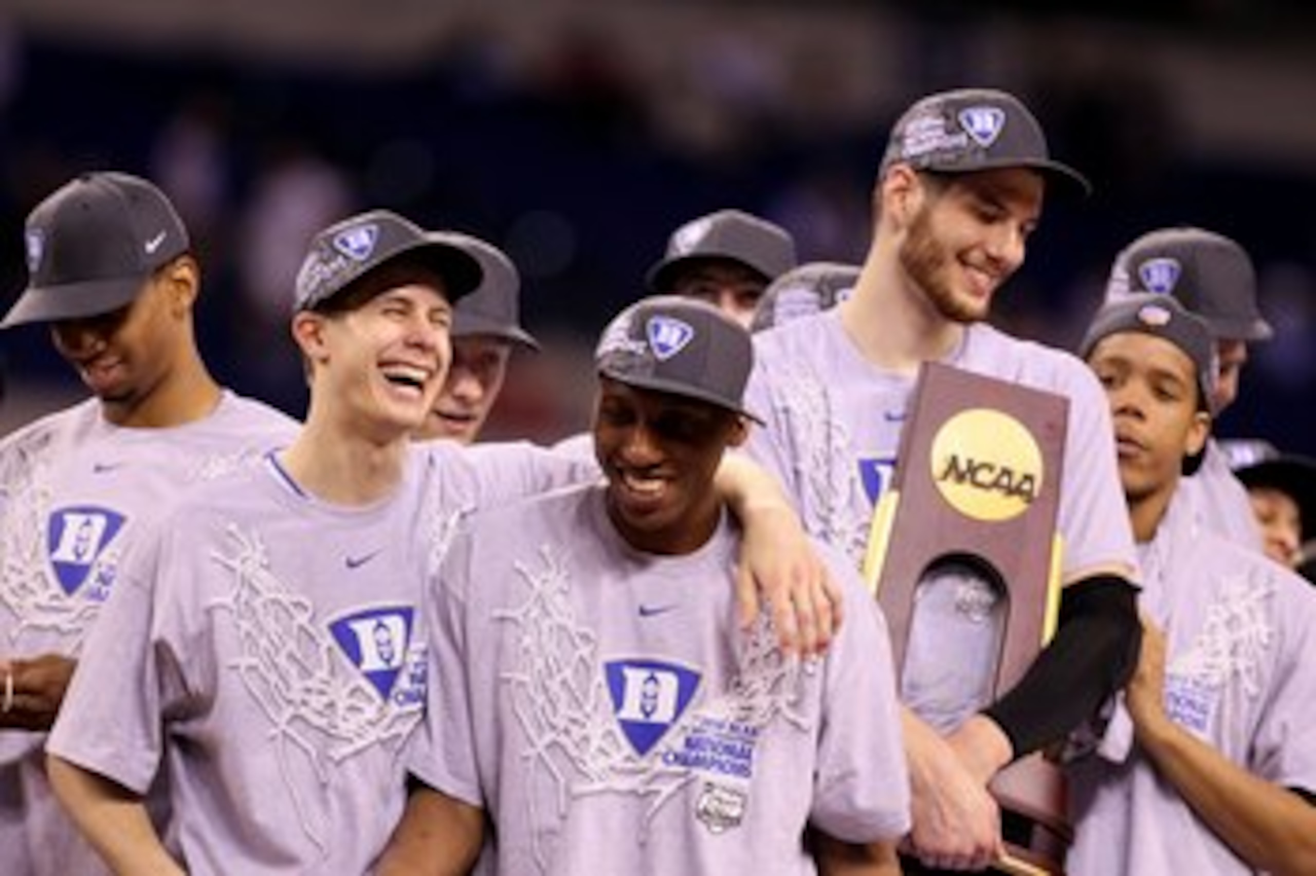 INDIANAPOLIS - APRIL 05:  (L-R) Jon Scheyer #30, Nolan Smith #2 and Brian Zoubek #55 of the Duke Blue Devils celebrate with the trophy after they won 61-59 against the Butler Bulldogs during the 2010 NCAA Division I Men's Basketball National Championship 