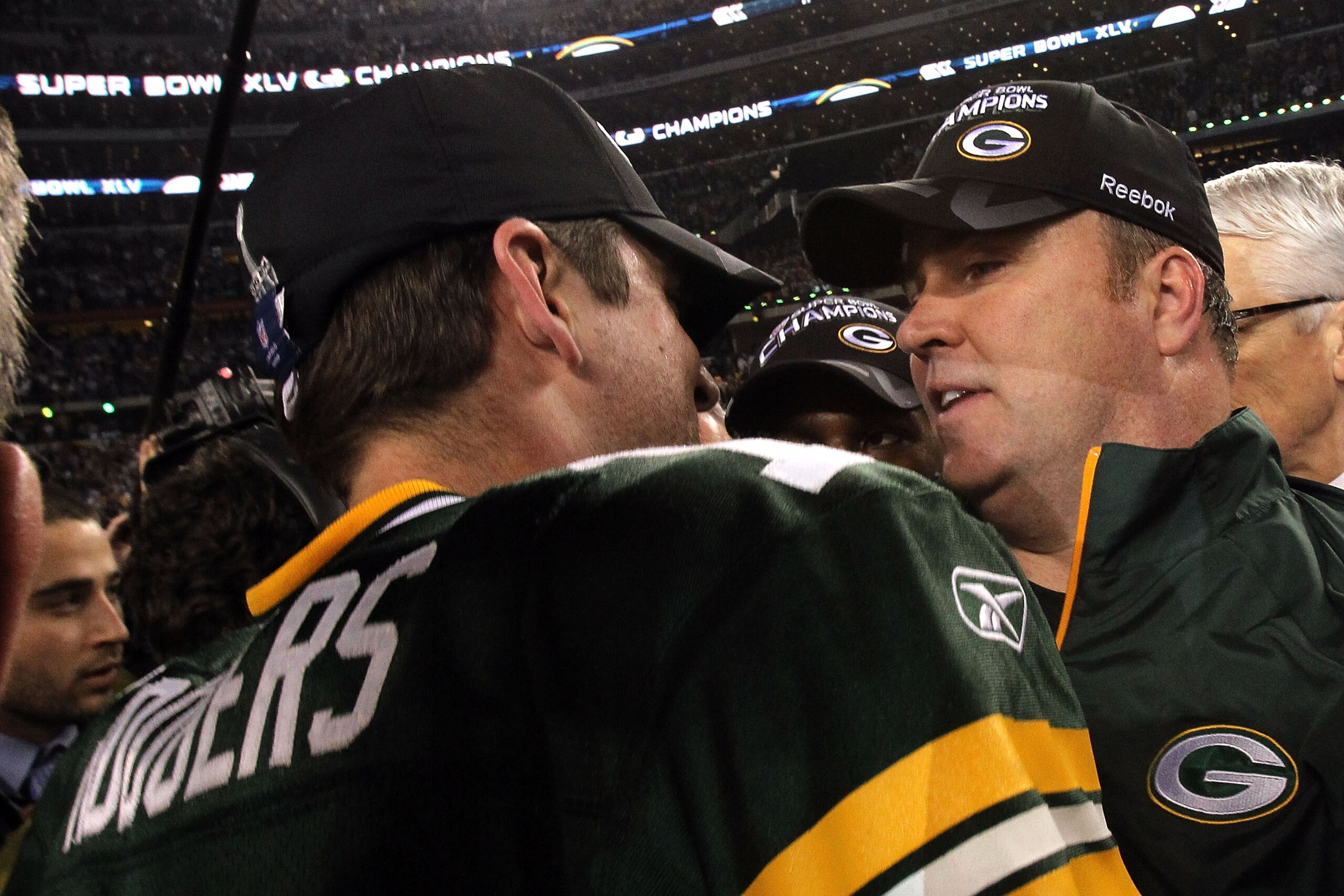 ARLINGTON, TX - FEBRUARY 06:  MVP Aaron Rodgers #12 and head coach Mike McCarthy of the Green Bay Packers celebrate after they defeated the Steelers 31 to 25 in Super Bowl XLV at Cowboys Stadium on February 6, 2011 in Arlington, Texas.  (Photo by Ronald M