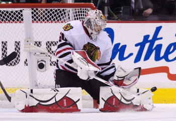 VANCOUVER, CANADA - APRIL 26: Goalie Corey Crawford #50 of the Chicago Blackhawks makes a pad save against the Vancouver Canucks during the second period in Game Seven of the Western Conference Quarterfinals during the 2011 NHL Stanley Cup Playoffs on Apr