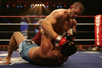 HOUSTON, TX - FEBRUARY 02:  John Marsh (blue shorts), heavyweight for the Sabres, fights against Chad Griggs of the Scorpions at the International Fight League event at the Reliant Arena on February 2, 2007 in Houston, Texas.  (Photo by Robert Laberge/Get