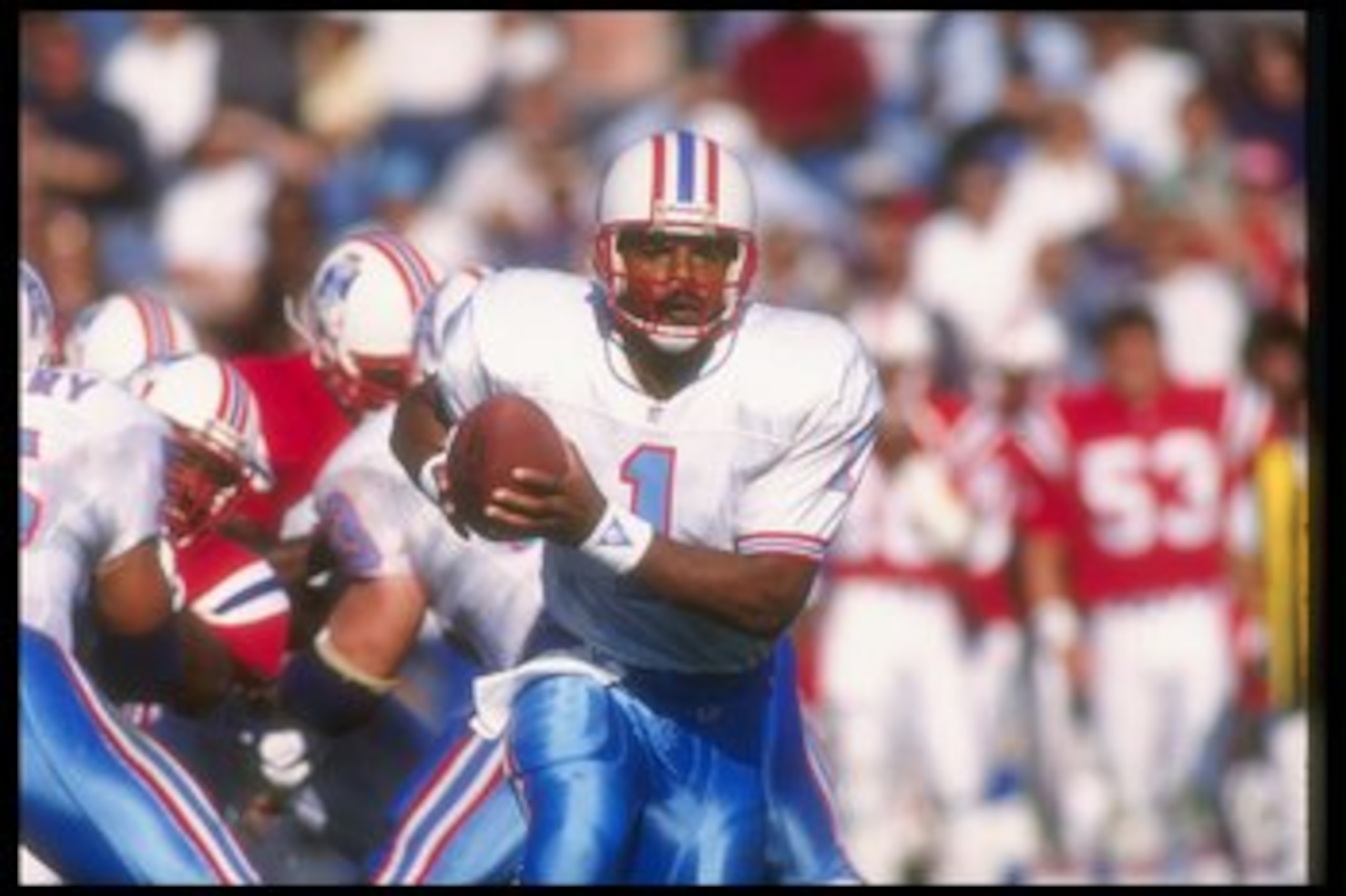 22 Sep 1991:  Quarterback Warren Moon of the Houston Oilers moves the ball during a game against the New England Patriots at Foxboro Stadium in Foxboro, Massachusetts.  The Patriots won the game, 24-20. Mandatory Credit: Rick Stewart  /Allsport