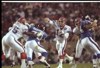 12 Jan 1991: Quarterback Jim Kelly #12 of the Buffalo Bills throws the ball against the New York Giants during Super Bowl XXV at Tampa Stadium in Tampa, Florida. The Giants won the game, 20-19.