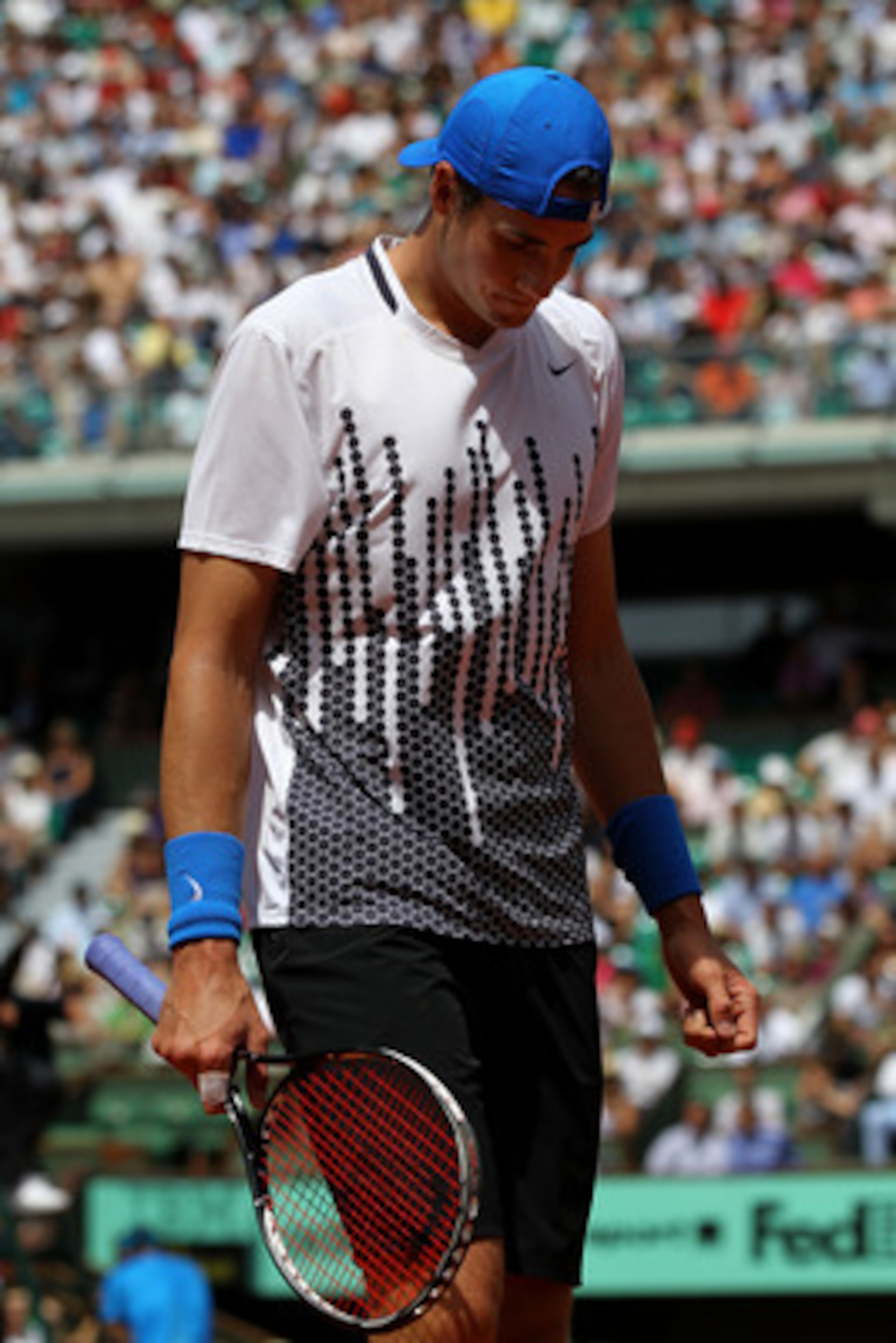 PARIS, FRANCE - MAY 24:  John Isner of USA shows his dejection during the men's singles round one match between Rafael Nadal of Spain and John Isner of USA on day three of the French Open at Roland Garros on May 24, 2011 in Paris, France.  (Photo by Matth