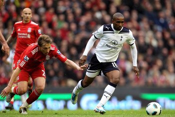 LIVERPOOL, ENGLAND - MAY 15:  Jermain Defoe of Spurs goes past Lucas of Liverpool during the Barclays Premier League match between Liverpool and Tottenham Hotspur at Anfield on May 15, 2011 in Liverpool, England.  (Photo by Michael Steele/Getty Images)