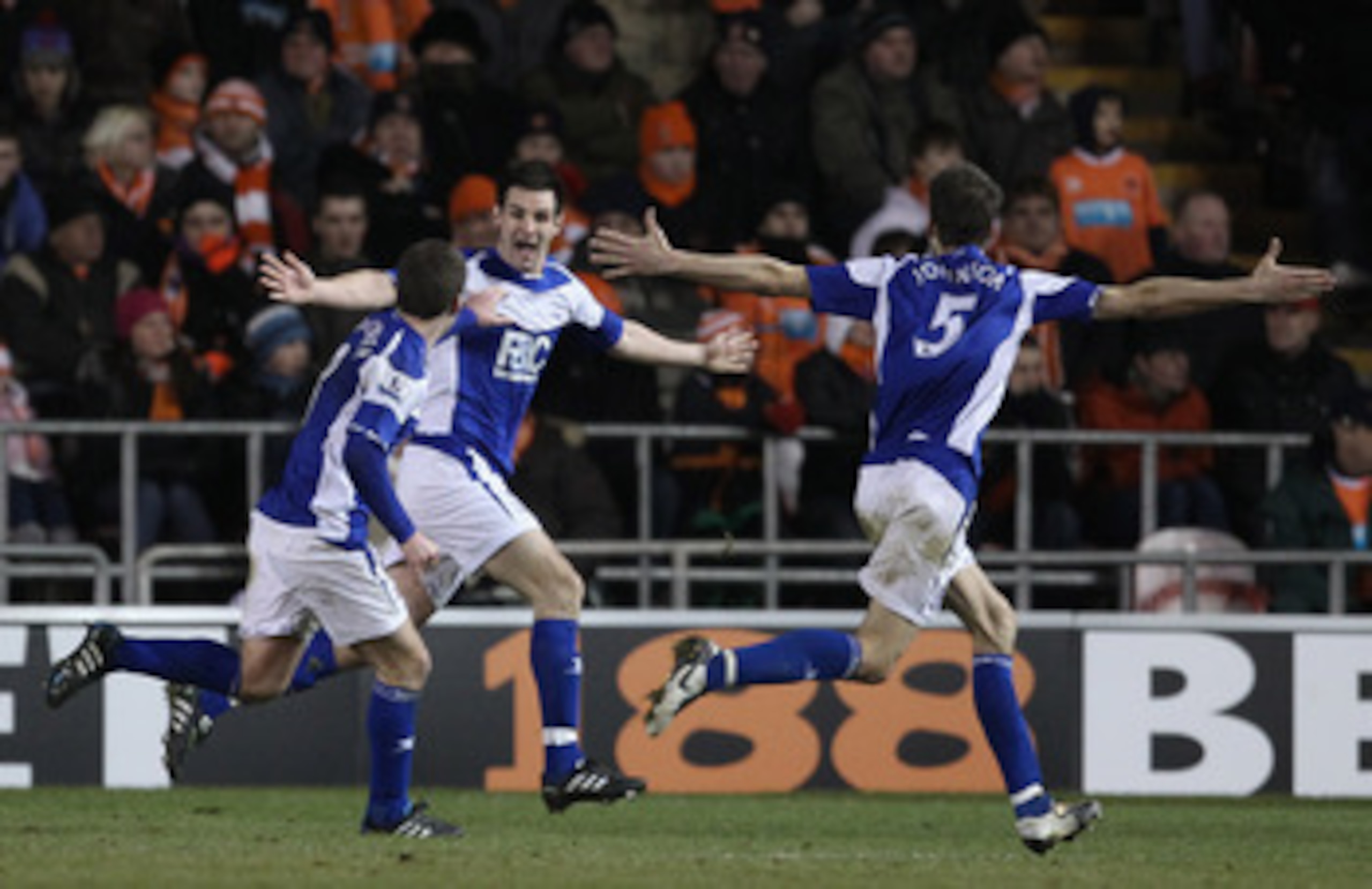 BLACKPOOL, ENGLAND - JANUARY 04:  Scott Dann of Birmingham City celebrates with Roger Johnson and Craig Gardner after scoring the winning goal during the Barclays Premier League match between Blackpool and Birmingham City at Bloomfield Road on January 4, 