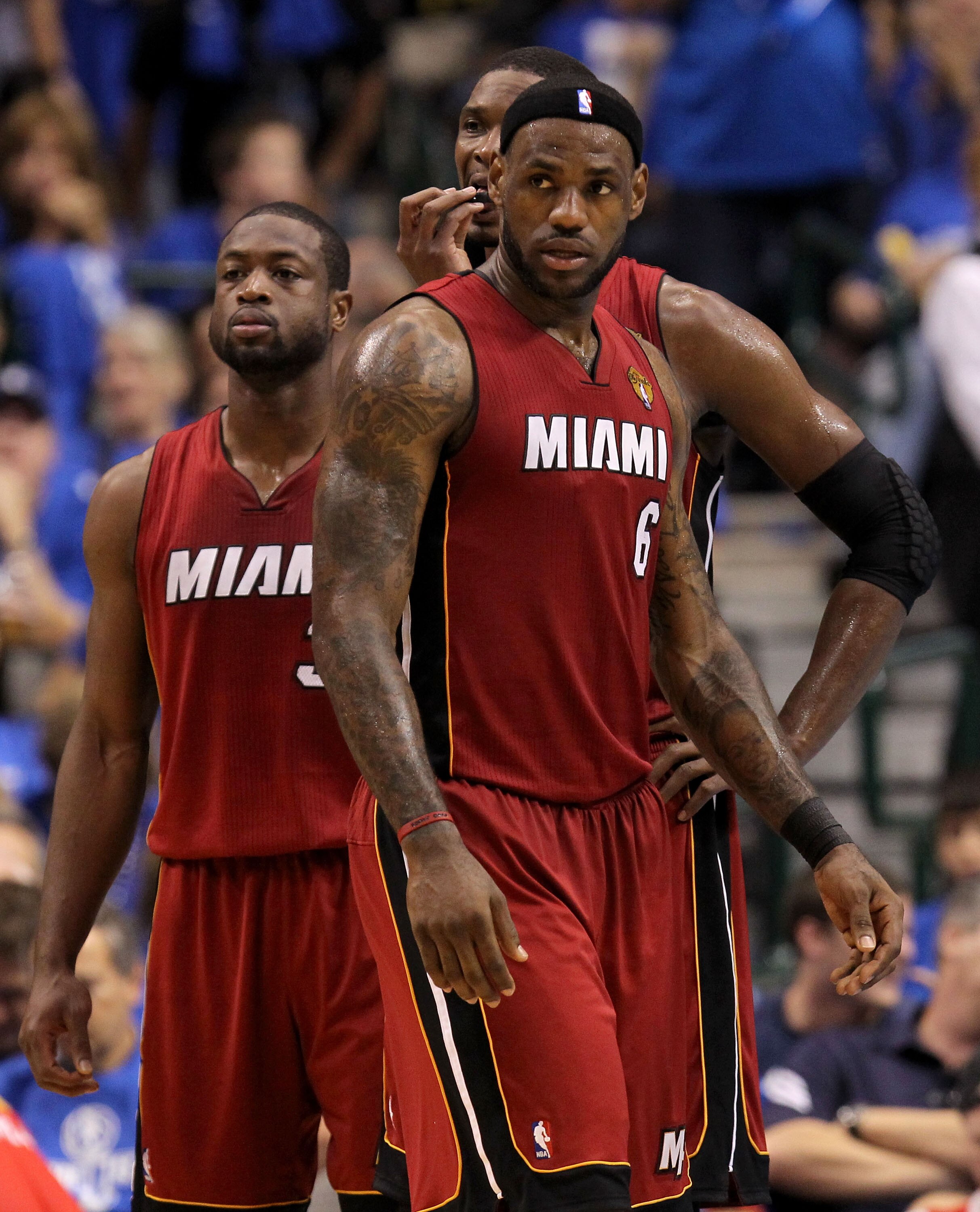 DALLAS, TX - JUNE 07: (L-R) Dwyane Wade #3, Chris Bosh #1 and LeBron James #6 of the Miami Heat look on against the Dallas Mavericks in Game Four of the 2011 NBA Finals at American Airlines Center on June 7, 2011 in Dallas, Texas. NOTE TO USER: User exp DALLAS, TX - JUNE 07: (L-R) Dwyane Wade #3, Chris Bosh #1 and LeBron James #6 of the Miami Heat look on against the Dallas Mavericks in Game Four of the 2011 NBA Finals at American Airlines Center on June 7, 2011 in Dallas, Texas. NOTE TO USER: User exp