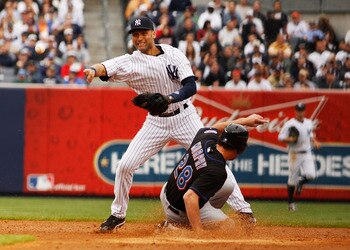 NEW YORK - MAY 22:  Daniel Murphy #28 of the New York Mets is forced out at second base as Derek Jeter #2 of the New York Yankees attempts to complete a double play on May 22, 2011 at Yankee Stadium in the Bronx borough of New York City.  (Photo by Mike S