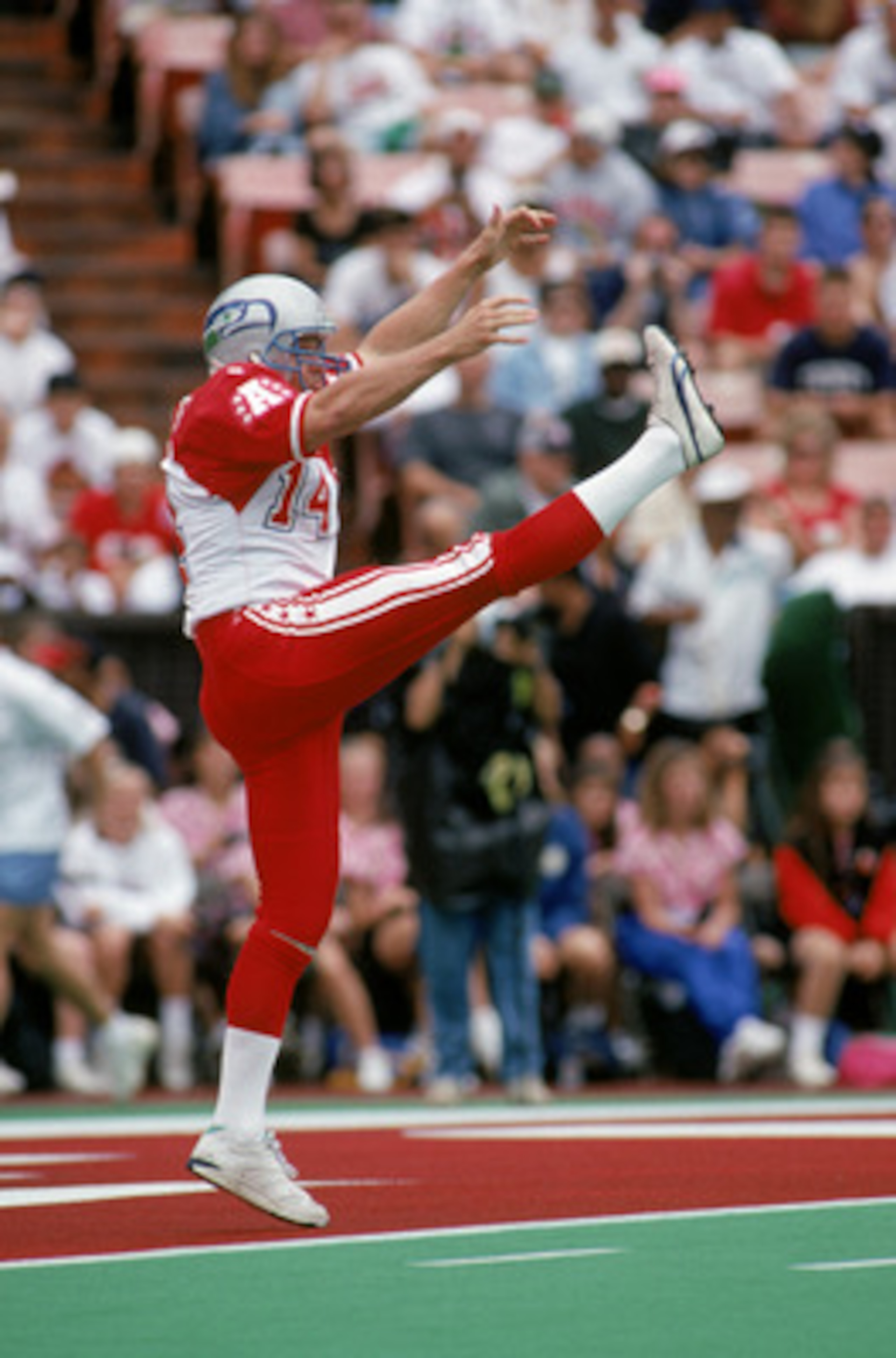HONOLULU, HI - FEBRUARY 5: Seattle Seahawks punter Rick Tuten #14 of the AFC Team kicks the ball away during the 1995 NFL Pro Bowl at Aloha Stadium on February 5, 1995 in Honolulu, Hawaii. The AFC defeated the NFC 41-13. (Photo by George Rose/Getty Ima HONOLULU, HI - FEBRUARY 5: Seattle Seahawks punter Rick Tuten #14 of the AFC Team kicks the ball away during the 1995 NFL Pro Bowl at Aloha Stadium on February 5, 1995 in Honolulu, Hawaii. The AFC defeated the NFC 41-13. (Photo by George Rose/Getty Ima