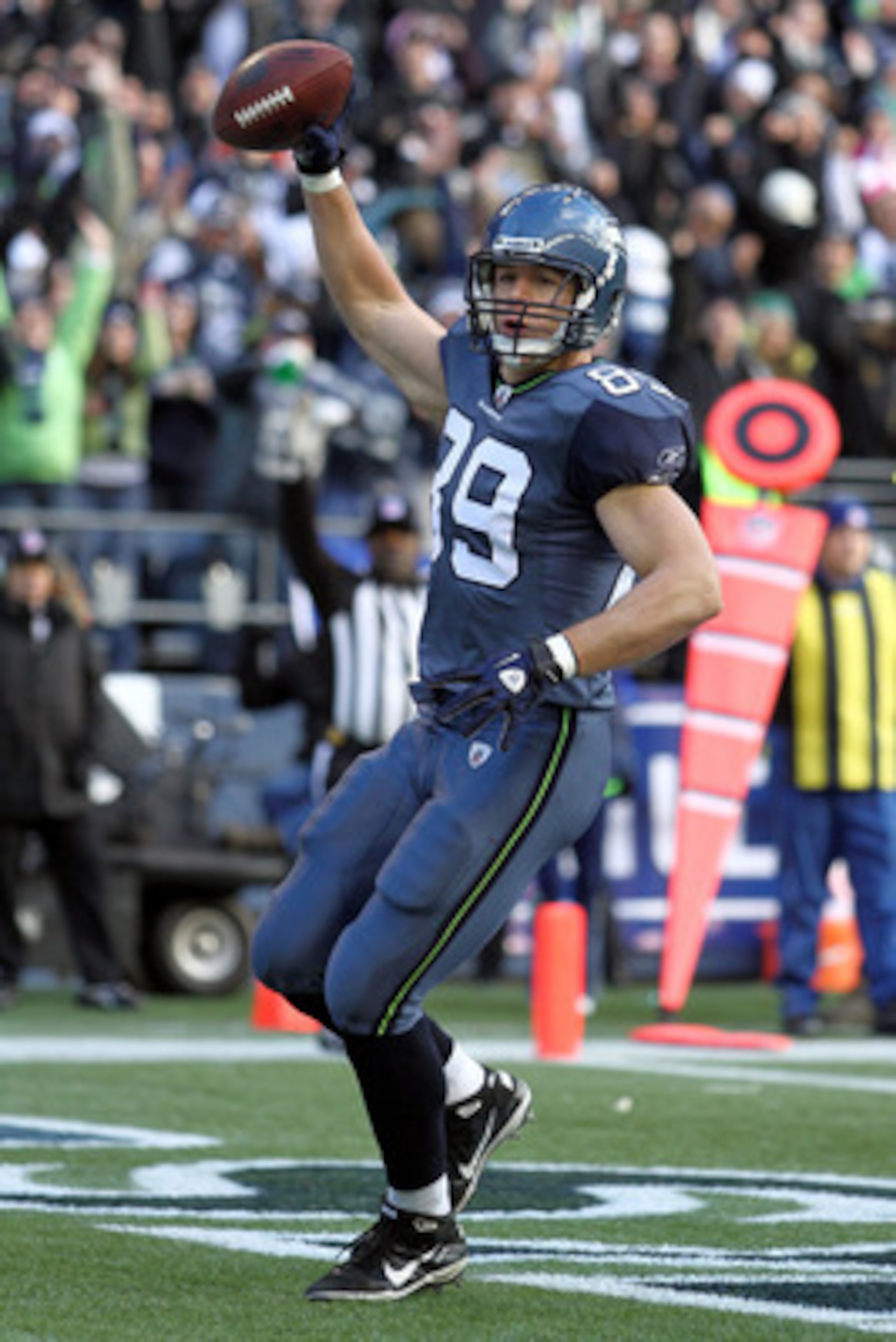 SEATTLE, WA - JANUARY 08: Tight end John Carlson #89 of the Seattle Seahawks celebrates his 11-yard touchdown reception in the first quarter against the New Orleans Saints during the 2011 NFC wild-card playoff game at Qwest Field on January 8, 2011 in Se SEATTLE, WA - JANUARY 08: Tight end John Carlson #89 of the Seattle Seahawks celebrates his 11-yard touchdown reception in the first quarter against the New Orleans Saints during the 2011 NFC wild-card playoff game at Qwest Field on January 8, 2011 in Se