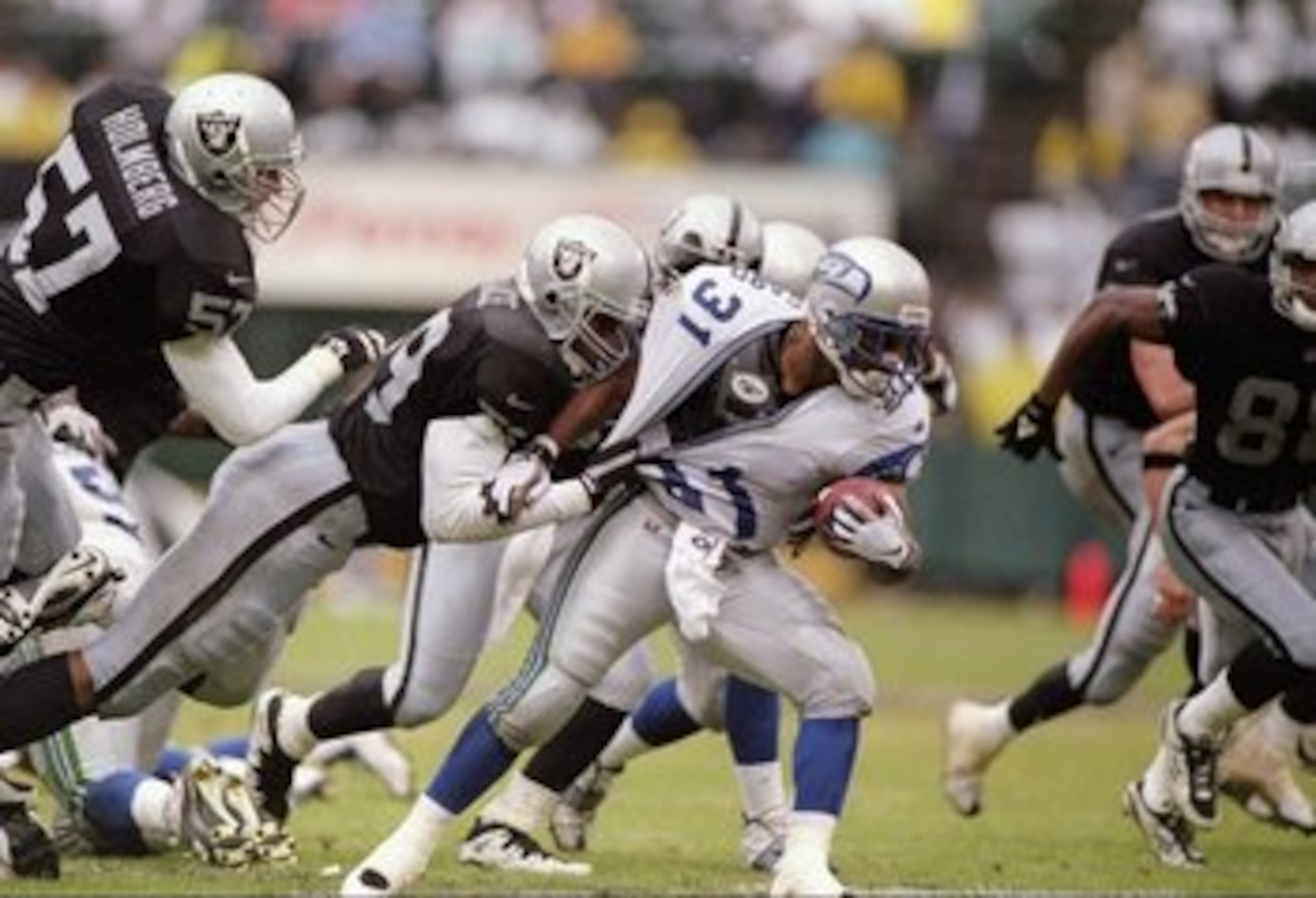 14 Dec 1997: Steve Broussard #31 of the Seattle Seahawks is wrapped up by defensive lineman Aundray Bruce #99 of the Oakland Raiders during the Seahawks 22-21 win at UMAX Stadium in Oakland, California. Mandatory Credit: Otto Greule /Allsport 14 Dec 1997: Steve Broussard #31 of the Seattle Seahawks is wrapped up by defensive lineman Aundray Bruce #99 of the Oakland Raiders during the Seahawks 22-21 win at UMAX Stadium in Oakland, California. Mandatory Credit: Otto Greule /Allsport