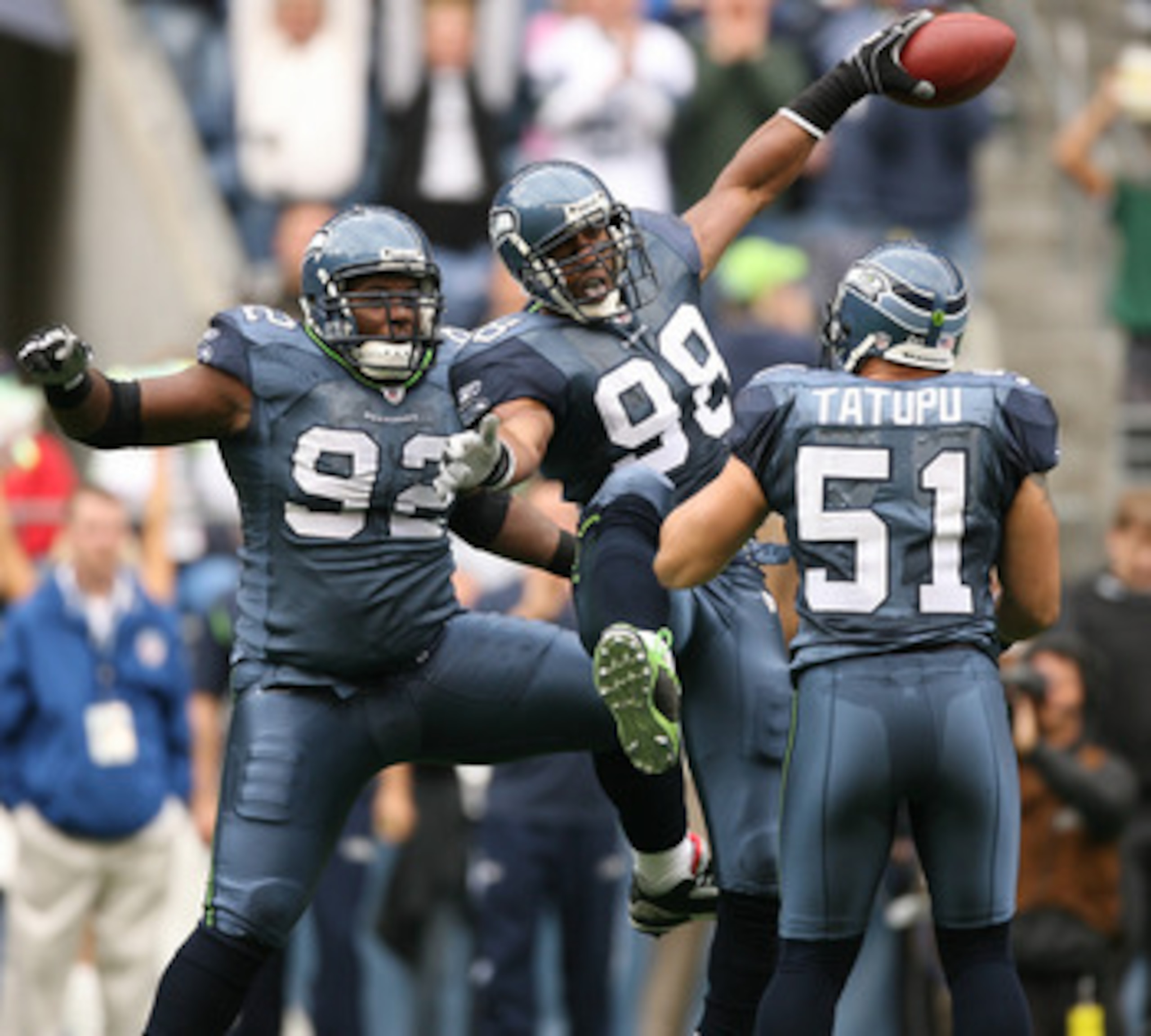 SEATTLE - SEPTEMBER 21: Linebacker Julian Peterson #98 of the Seattle Seahawks celebrates with Brandon Mebane #92 and Lofa Tatupu #51 after recovering a fumble against the St. Louis Rams on September 21, 2008 at Qwest Field in Seattle Washington. The Sea SEATTLE - SEPTEMBER 21: Linebacker Julian Peterson #98 of the Seattle Seahawks celebrates with Brandon Mebane #92 and Lofa Tatupu #51 after recovering a fumble against the St. Louis Rams on September 21, 2008 at Qwest Field in Seattle Washington. The Sea