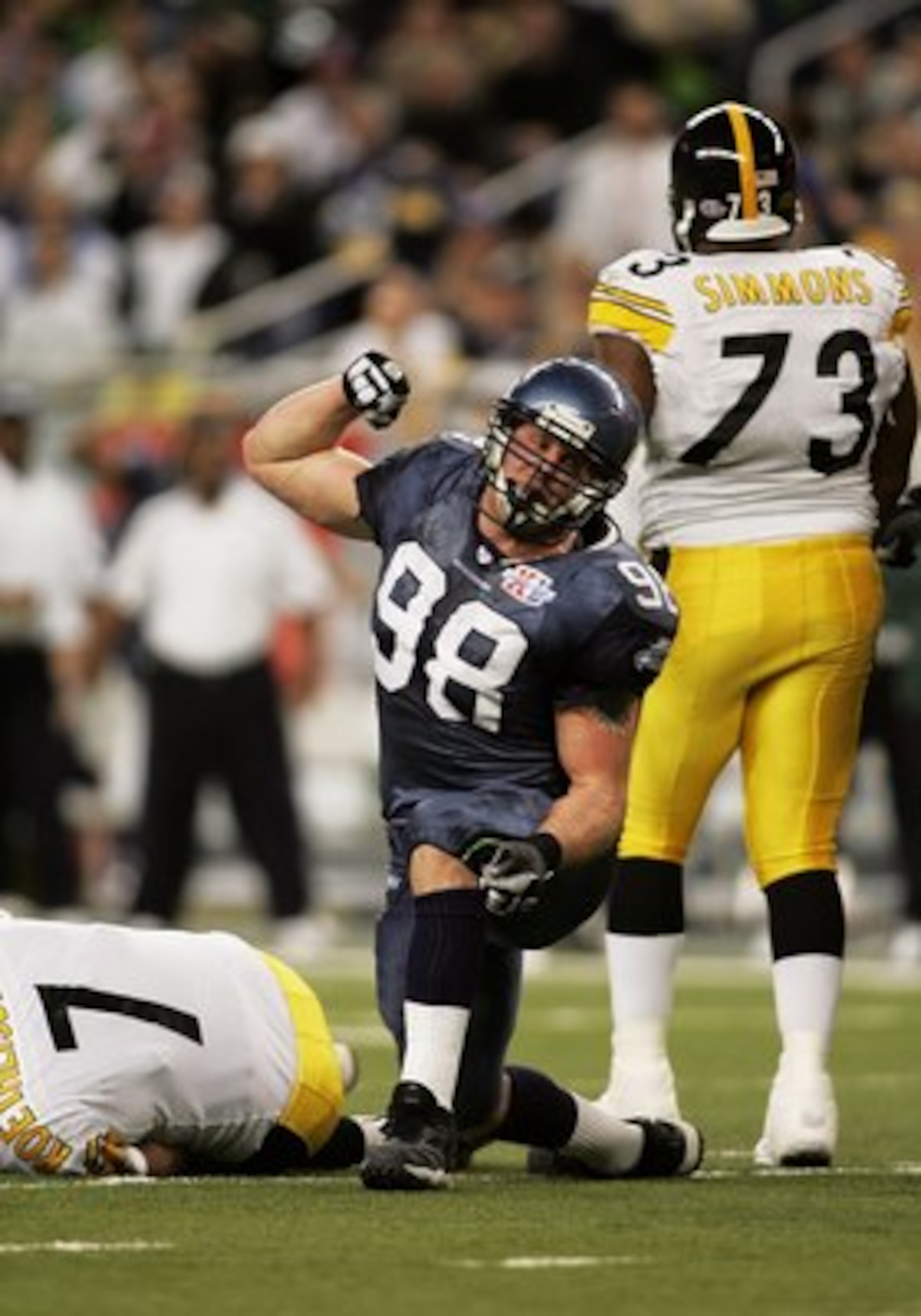 DETROIT - FEBRUARY 5:  Defensive end Grant Wistrom #98 of the Seattle Seahawks celebrates after sacking quarter Ben Roethlisberger #7 of the Pittsburgh Steelers in the first half of Super Bowl XL at Ford Field on February 5, 2006 in Detroit, Michigan. (Ph