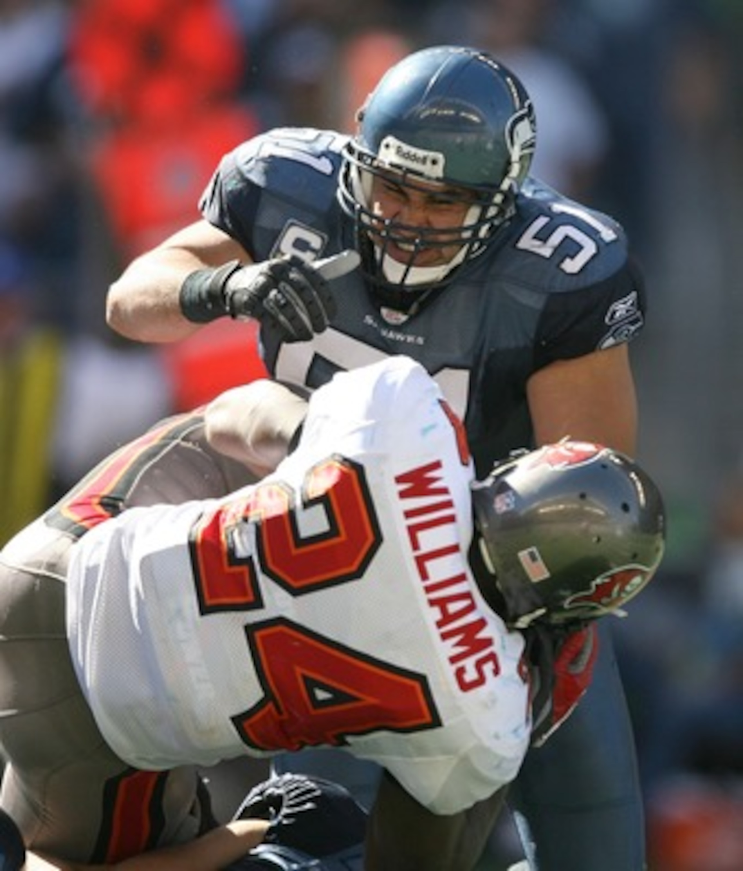 SEATTLE - SEPTEMBER 09: Running back Carnell Williams #24 of the Tampa Bay Buccaneers is tackled by Lofa Tatupu #51 of the Seattle Seahawks at Qwest Field on September 9, 2007 in Seattle, Washington. The Seahawks defeated the Buccaneers 20-6. (Photo by SEATTLE - SEPTEMBER 09: Running back Carnell Williams #24 of the Tampa Bay Buccaneers is tackled by Lofa Tatupu #51 of the Seattle Seahawks at Qwest Field on September 9, 2007 in Seattle, Washington. The Seahawks defeated the Buccaneers 20-6. (Photo by