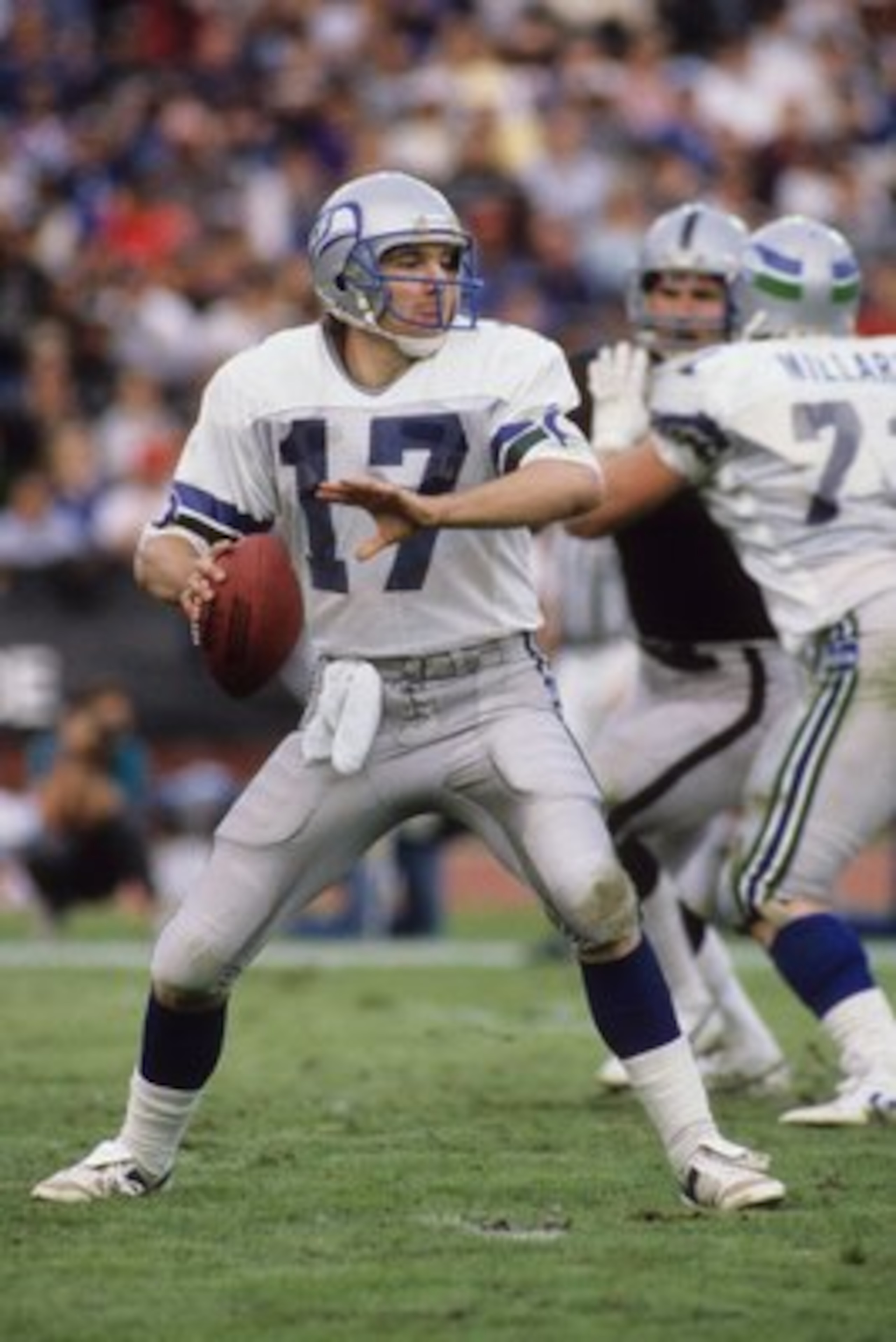 LOS ANGELES, CA - DECEMBER 15: Quarterback Dave Krieg #17 of the Seattle Seahawks drops back to pass during the game against the Los Angeles Raiders at Los Angeles Memorial Coliseum on December 15, 1985 in Los Angeles, California. The Raiders won 13-3. LOS ANGELES, CA - DECEMBER 15: Quarterback Dave Krieg #17 of the Seattle Seahawks drops back to pass during the game against the Los Angeles Raiders at Los Angeles Memorial Coliseum on December 15, 1985 in Los Angeles, California. The Raiders won 13-3.
