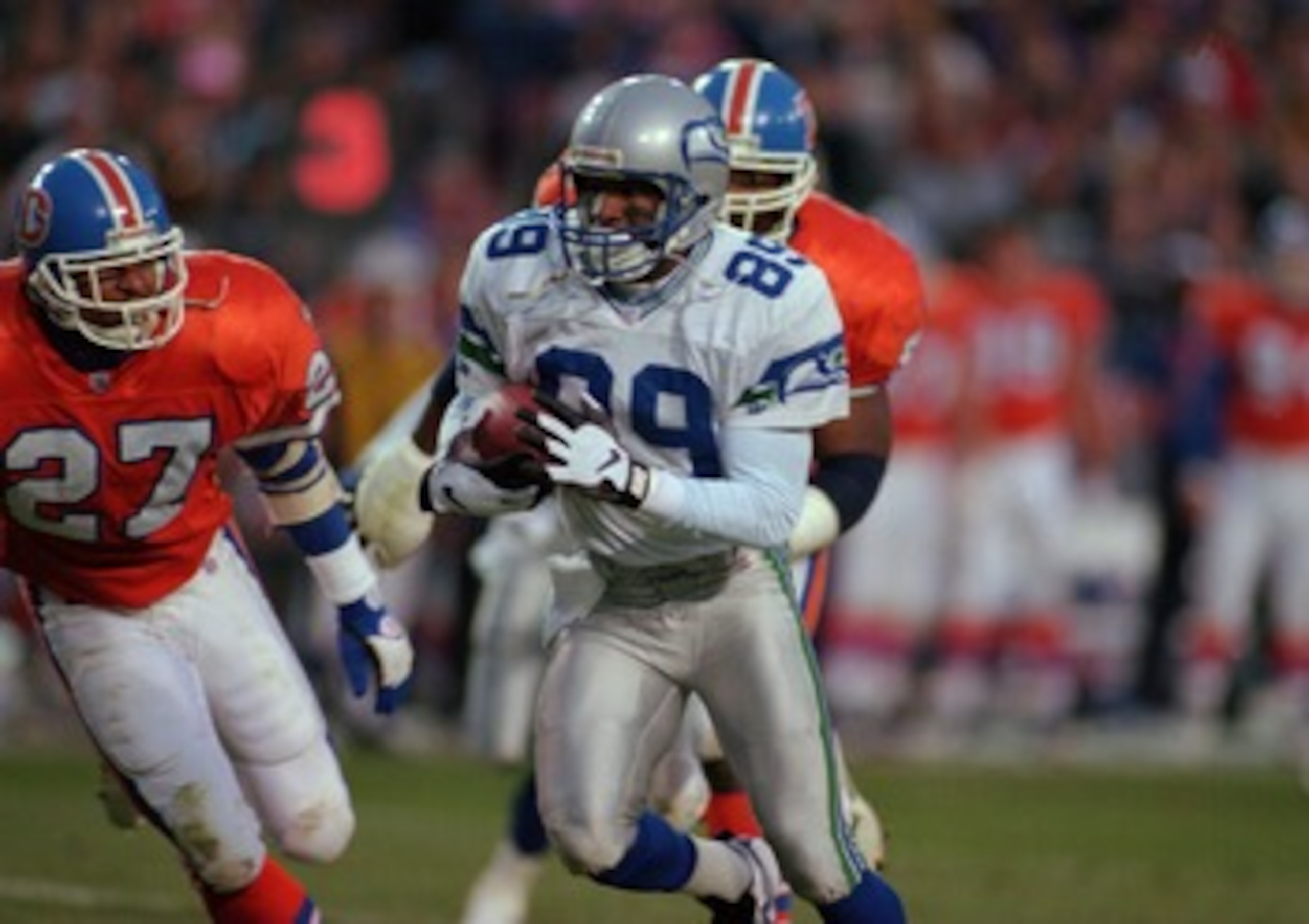 10 Dec 1995: Wide Receiver Brian Blades #89 of the Seattle Seahawks avoids defensive back Steve Atwater of the Denver Broncos during the Seahawks 31-27 win at Mile High Stadium in Denver, Colorado. Mandatory Credit: Al Bello/ALLSPORT 10 Dec 1995: Wide Receiver Brian Blades #89 of the Seattle Seahawks avoids defensive back Steve Atwater of the Denver Broncos during the Seahawks 31-27 win at Mile High Stadium in Denver, Colorado. Mandatory Credit: Al Bello/ALLSPORT