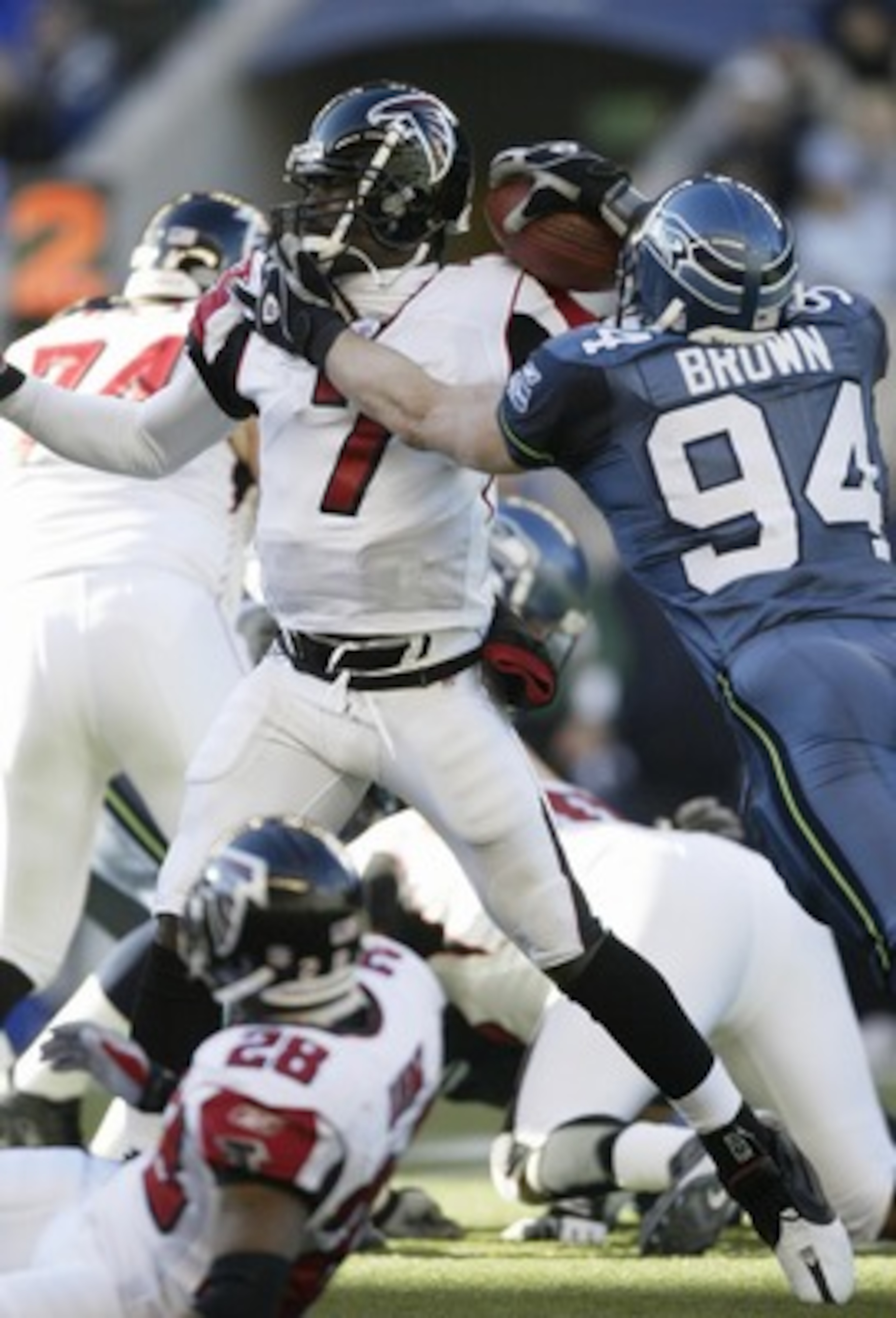 SEATTLE - JANUARY 2:  Chad Brown #94 of the Seattle Seahawks sacks quarterback Michael Vick #7 of the Atlanta Falcons at Qwest Field on January 2, 2005 in Seattle, Washington. (Photo by Otto Greule Jr/Getty Images)