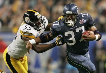 DETROIT - FEBRUARY 5:  Running back Shaun Alexander #37 of the Seattle Seahawks tries to avoid a tackle by linebacker Joey Porter #55 of the Pittsburgh Steelers in the third quarter of Super Bowl XL at Ford Field on February 5, 2006 in Detroit, Michigan.