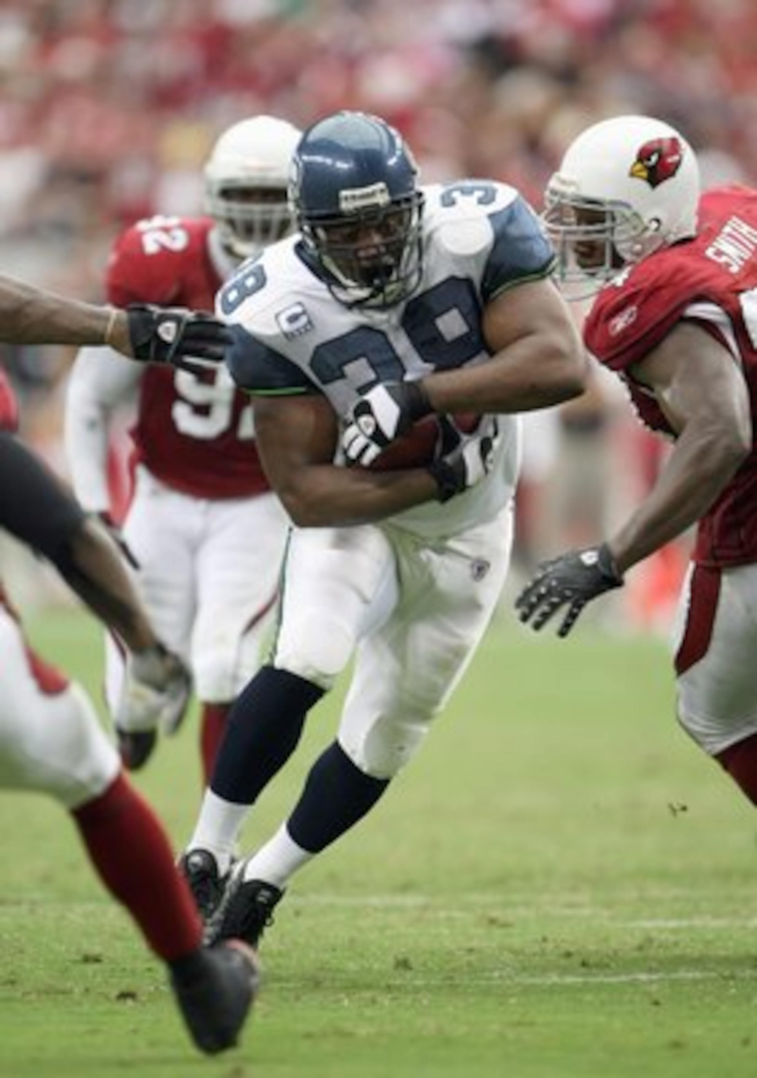 GLENDALE, AZ - SEPTEMBER 16:Mack Strong #38 of the Seattle Seahawks carries the ball during the game with the Arizona Cardinals at University of Phoenix Stadium September 16, 2007 in Glendale, Arizona. (Photo by Stephen Dunn/Getty Images) GLENDALE, AZ - SEPTEMBER 16:Mack Strong #38 of the Seattle Seahawks carries the ball during the game with the Arizona Cardinals at University of Phoenix Stadium September 16, 2007 in Glendale, Arizona. (Photo by Stephen Dunn/Getty Images)