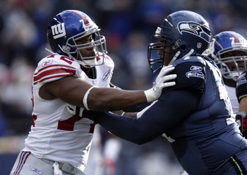 SEATTLE - NOVEMBER 27:  Defensive end Osi Umenyiora #71 of the New York Giants attempts to get around the block of tackle Walter Jones #72 of the Seattle Seahawks during the game at Qwest Field on November 27, 2005 in Seattle, Washington. The Seahawks won