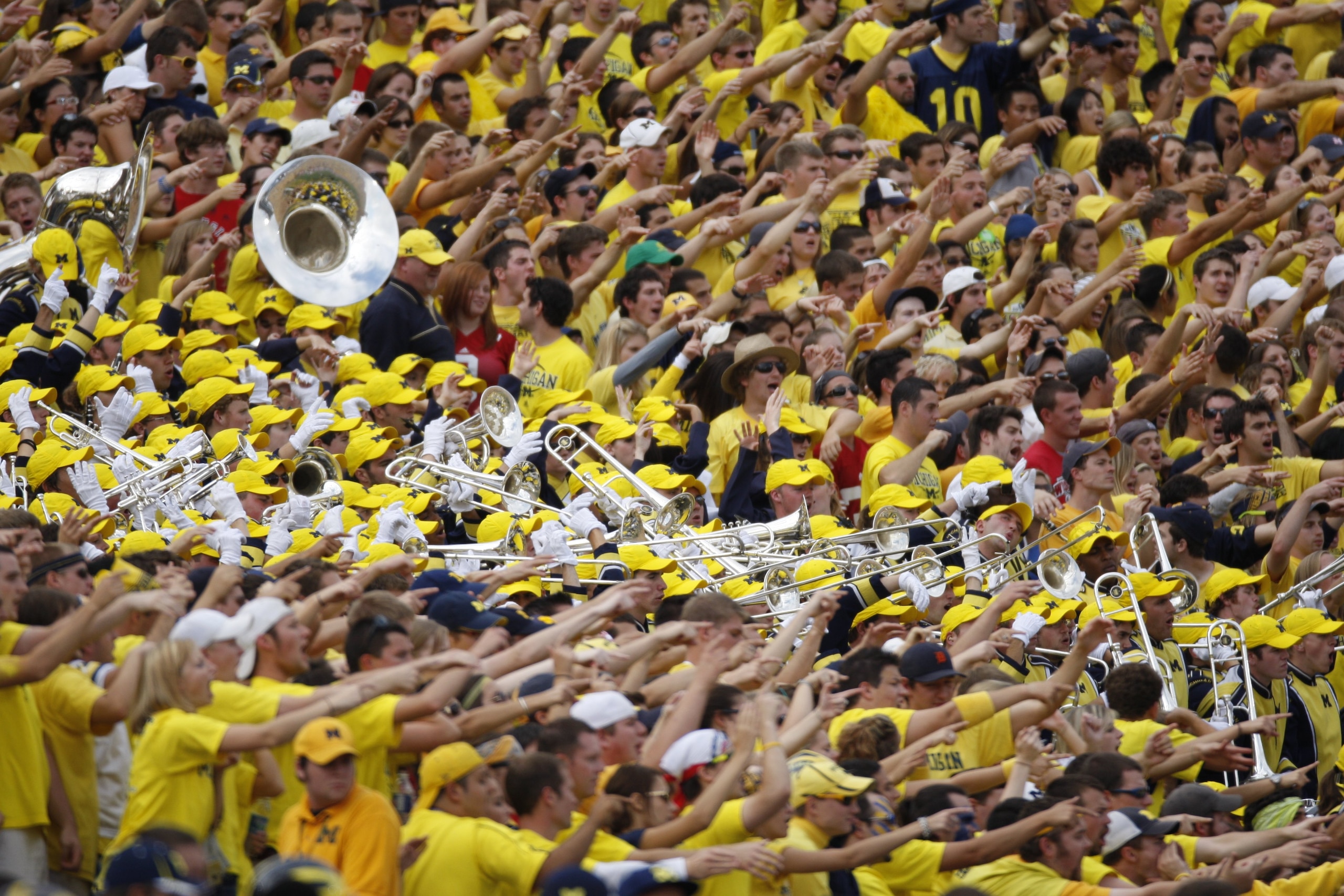 ANN ARBOR, MI - SEPTEMBER 27:  Fans and members of the Michigan Wolverines marching band cheer during the game against the Wisconsin Badgers on September 27, 2008 at Michigan Stadium in Ann Arbor, Michigan. (Photo by Gregory Shamus/Getty Images)