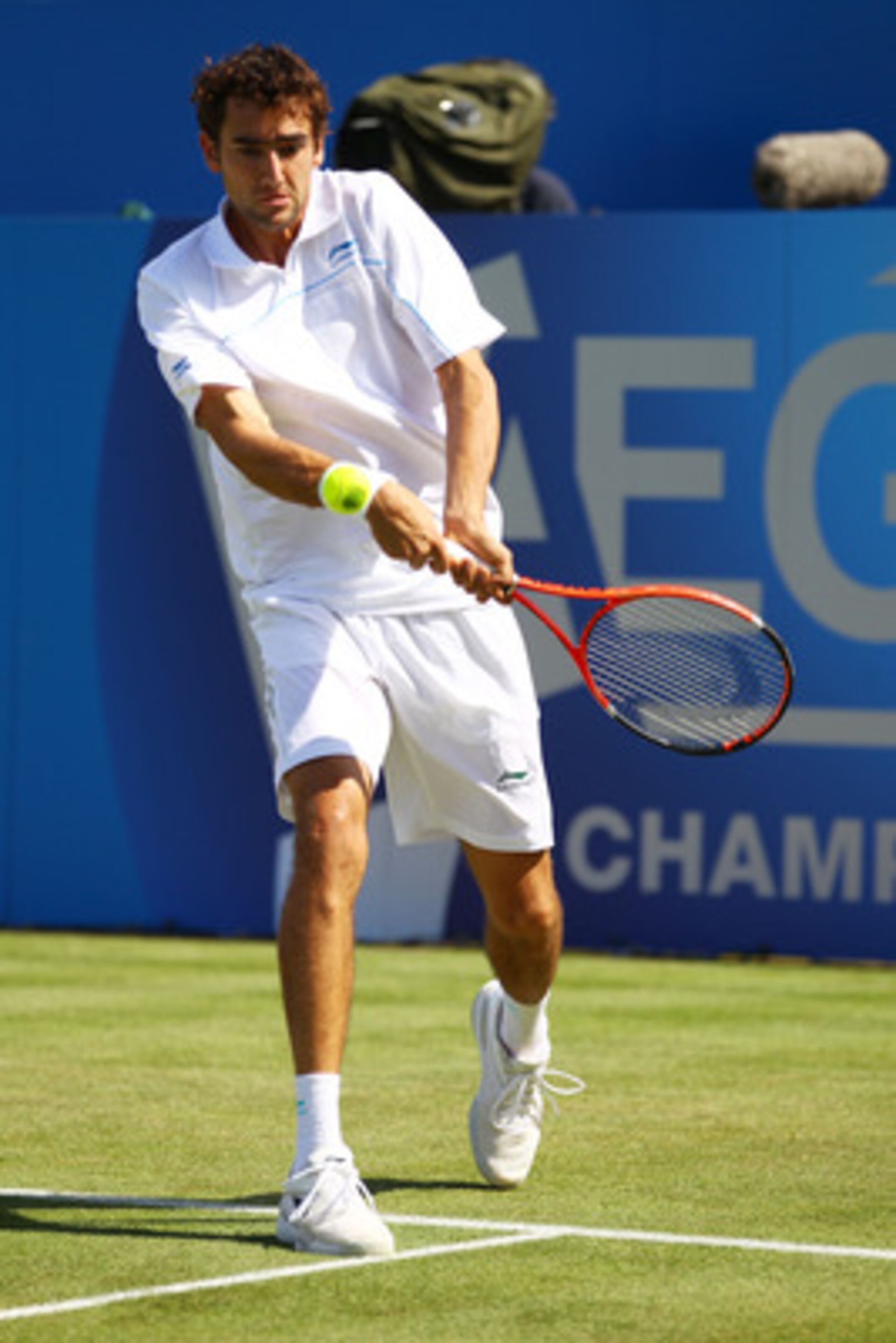 LONDON, ENGLAND - JUNE 08:  Marin Cilic of Croatia returns a shot during his Men's Singles second round match against Arnaud Clement of France on day three of the AEGON Championships at Queens Club on June 8, 2011 in London, England.  (Photo by Clive Brun
