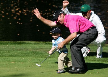AUGUSTA, GA - APRIL 04:  Rod Papmling of Australia celebrates with his son Samuel on the ninth green during the Par-3 contest prior to the start of The Masters at the Augusta National Golf Club on April 4, 2007 in Augusta, Georgia.  (Photo by Harry How/Ge