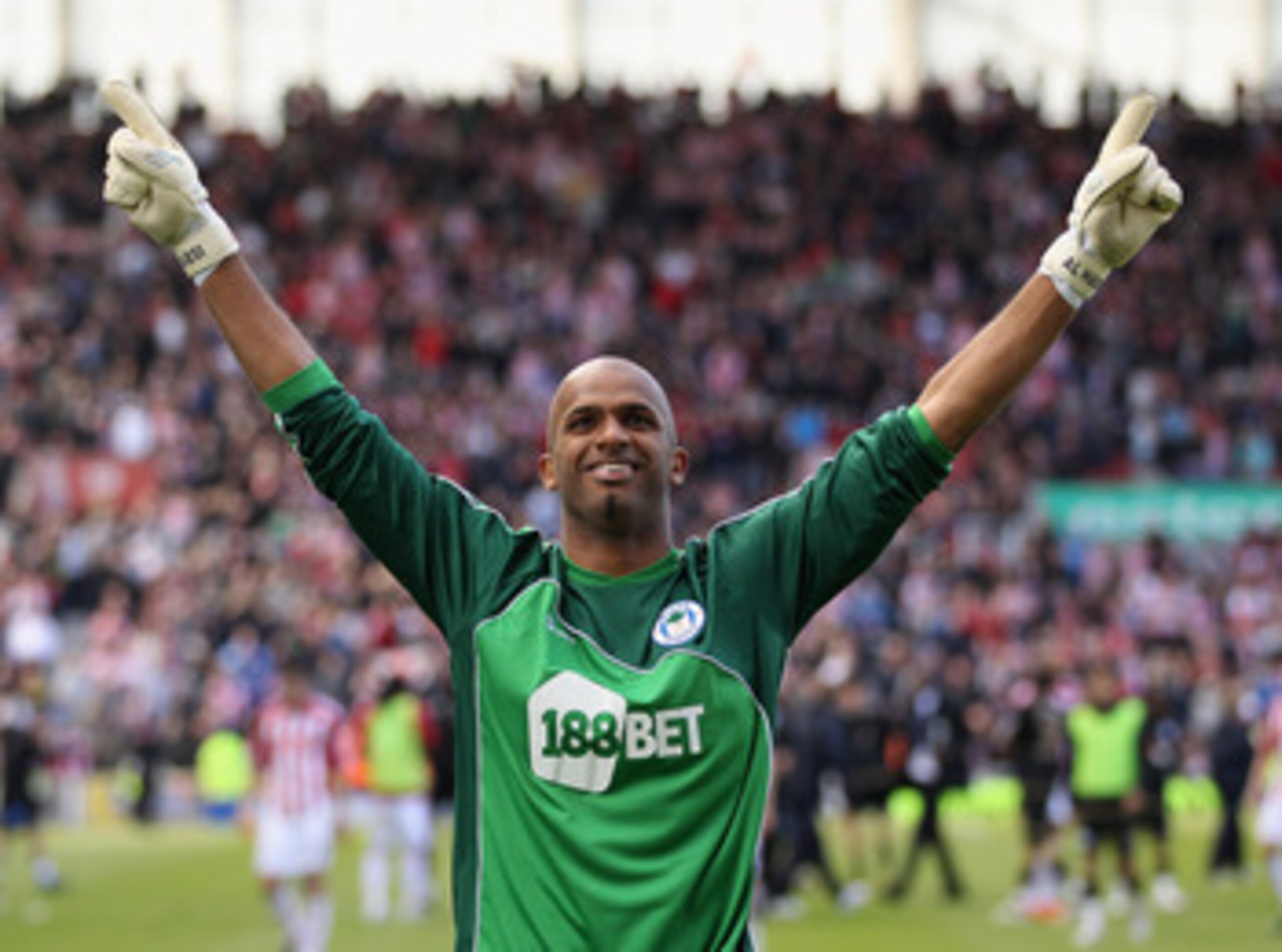 STOKE ON TRENT, ENGLAND - MAY 22:  Ali Al Habsi of Wigan celebrates staying up during the Barclays Premier League match between Stoke City and Wigan Athletic at Britannia Stadium on May 22, 2011 in Stoke on Trent, England.  (Photo by Richard Heathcote/Get