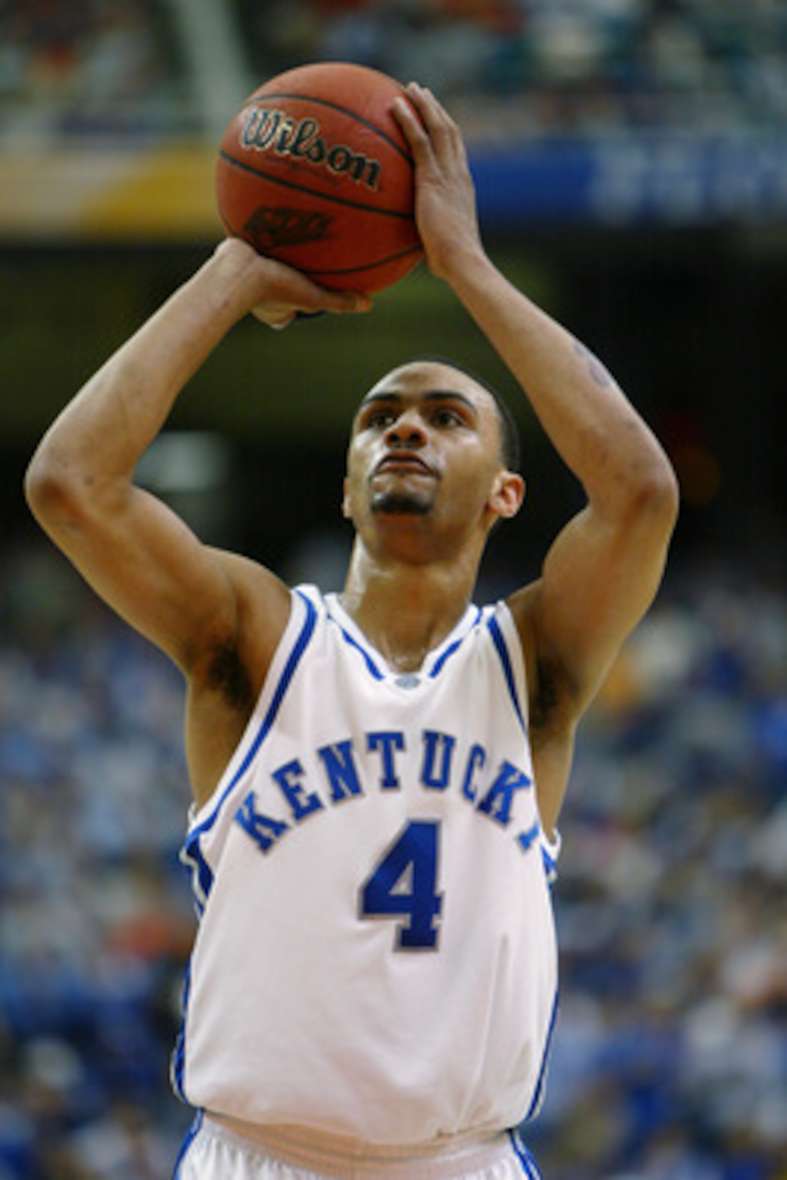 ATLANTA - MARCH 14:  Gerald Fitch #4 of the University of Kentucky Wildcats shoots a free throw against the University of Florida Gators during the SEC Men's Basketball Tournament Championship game at the Georgia Dome on March 14, 2004 in Atlanta, Georgia