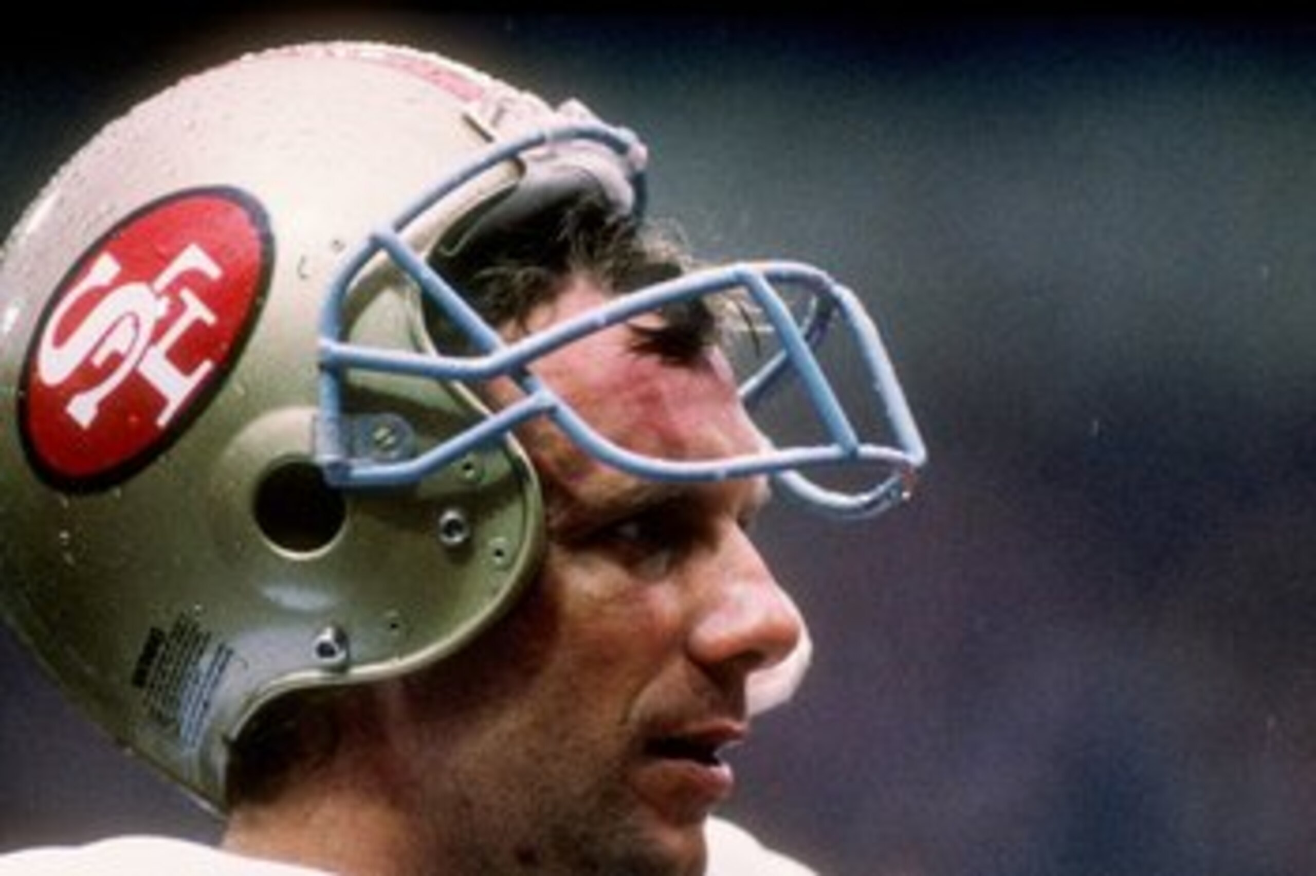 31 Jul 1988: Quarterback Joe Montana of the San Francisco 49ers stands on the sidelines during the American Bowl against the Miami Dolphins at Wembley Stadium in London, England. The Dolphins won the game 27-21.