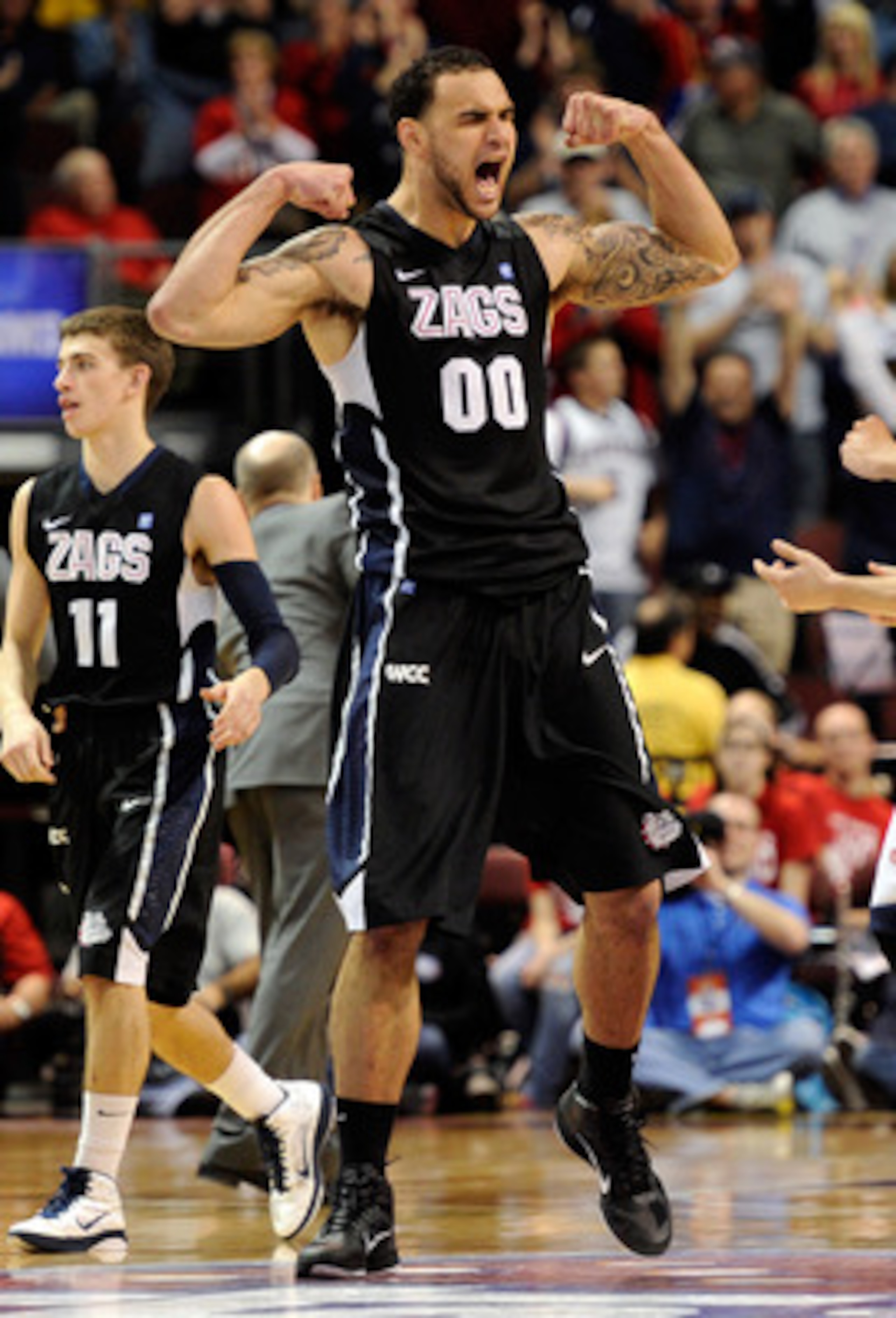 LAS VEGAS, NV - MARCH 07:  Robert Sacre #00 of the Gonzaga Bulldogs celebrates late in the team's 75-63 victory over the Saint Mary's Gaels in the championship game of the Zappos.com West Coast Conference Basketball tournament at the Orleans Arena March 7