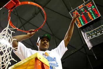 ATLANTA - MARCH 28:   Chris Duhon #21 of the Duke Blue Devils cuts down the net after Duke defeated the Xavier Muskateers 66-63 to win the fourth round game of the NCAA Division I Men's Basketball Tournament at the Georgia Dome on March 28, 2004 in Atlant