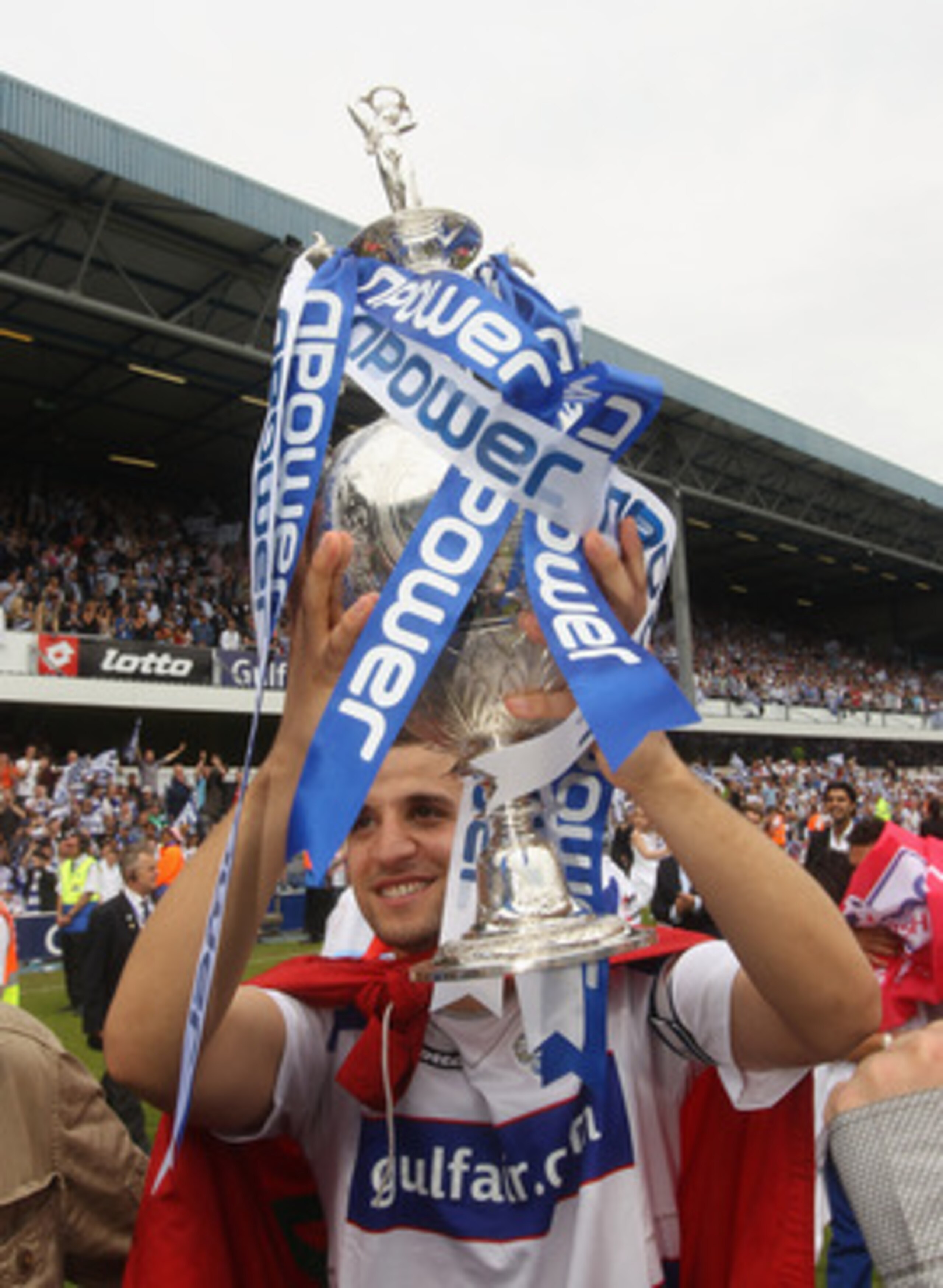 LONDON, ENGLAND - MAY 07:  Adel Taarabt of QPR celebrates with the trophy after winning the npower Championship match between Queens Park Rangers and Leeds United at Loftus Road on May 7, 2011 in London, England.  (Photo by Ian Walton/Getty Images)