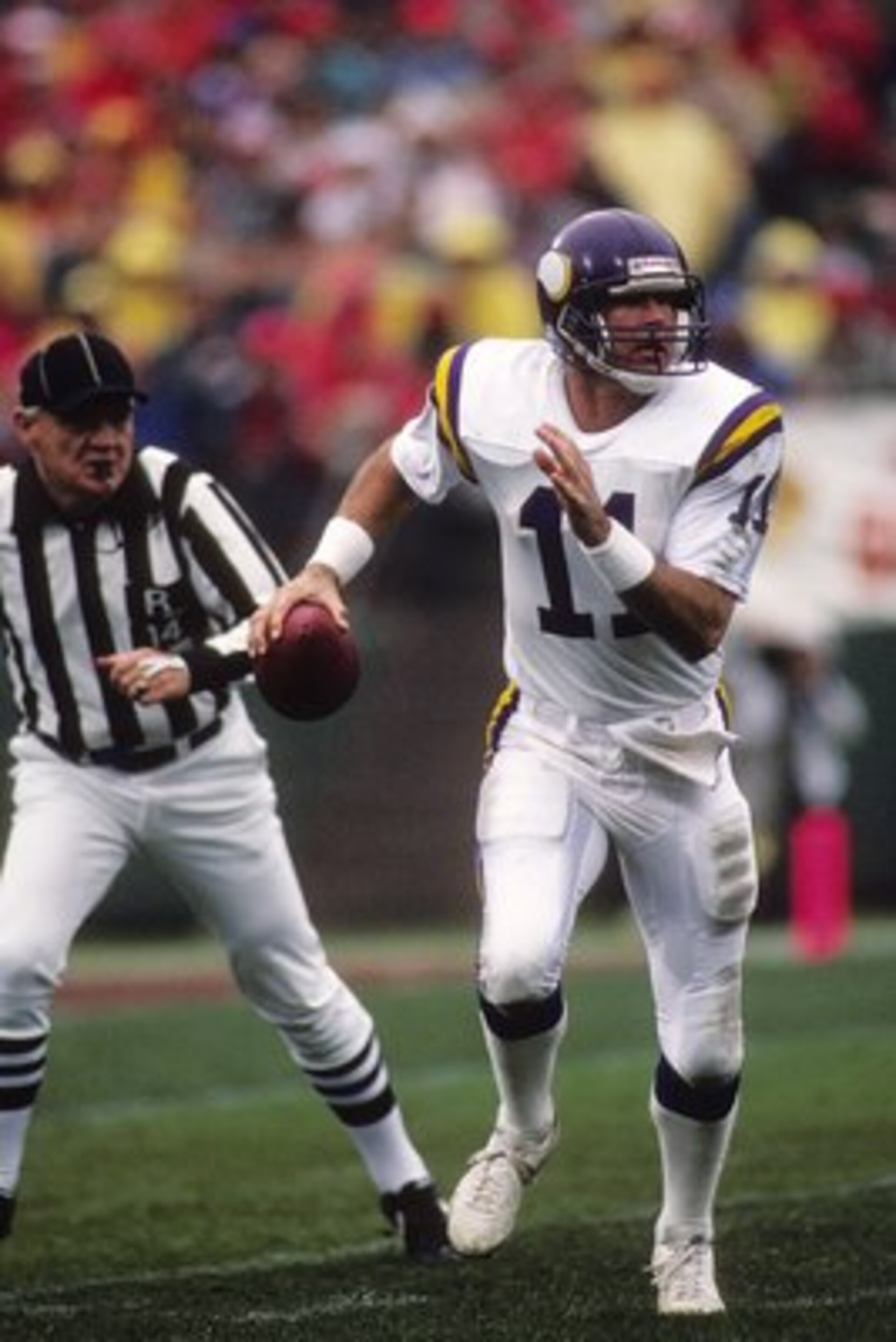 SAN FRANCISCO - JANUARY 9:  Quarterback Wade Wilson #11 of the Minnesota Vikings scrambles with the ball during the 1987 NFC Divisional Playoffs against the San Francisco 49ers at Candlestick Park on January 9, 1988 in San Francisco, California.  The Viki