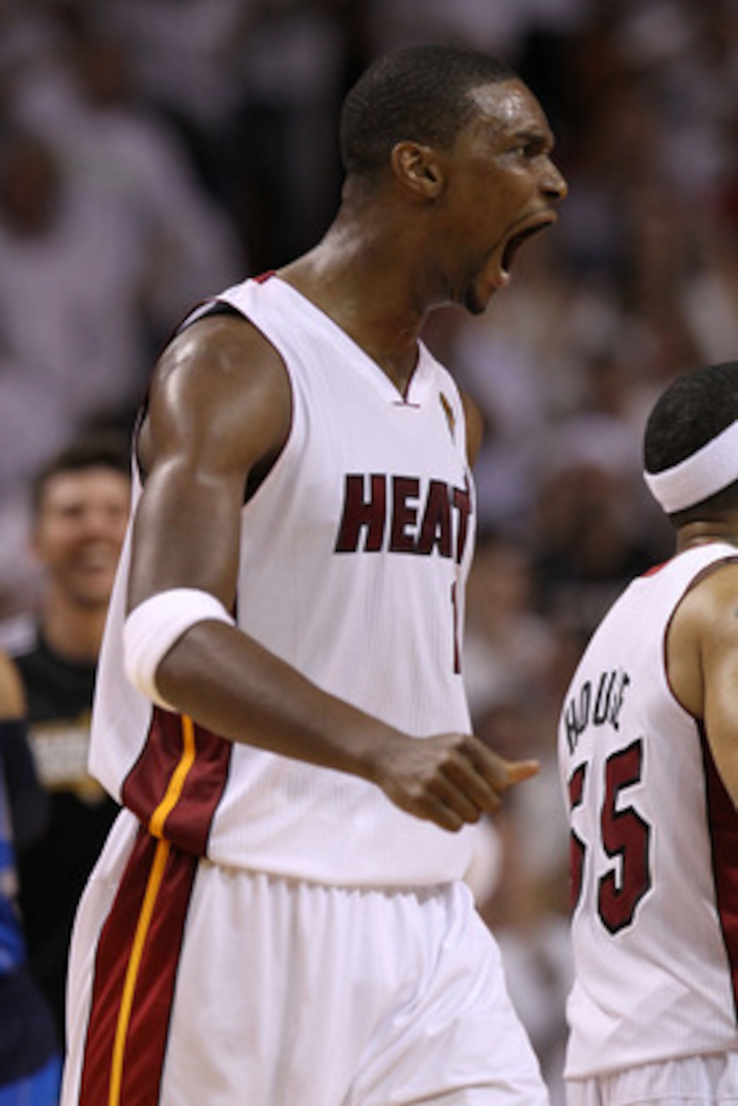 MIAMI, FL - JUNE 12: Chris Bosh #1 of the Miami Heat reacts in the first half against the Dallas Mavericks in Game Six of the 2011 NBA Finals at American Airlines Arena on June 12, 2011 in Miami, Florida. NOTE TO USER: User expressly acknowledges and agr MIAMI, FL - JUNE 12: Chris Bosh #1 of the Miami Heat reacts in the first half against the Dallas Mavericks in Game Six of the 2011 NBA Finals at American Airlines Arena on June 12, 2011 in Miami, Florida. NOTE TO USER: User expressly acknowledges and agr