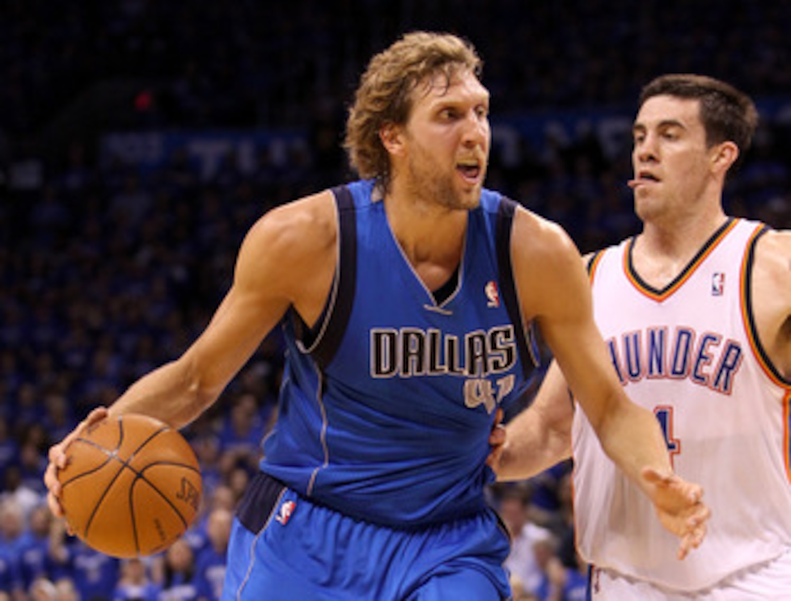 OKLAHOMA CITY, OK - MAY 23:  Dirk Nowitzki #41 of the Dallas Mavericks drives on Nick Collison #4 of the Oklahoma City Thunder in Game Four of the Western Conference Finals during the 2011 NBA Playoffs at Oklahoma City Arena on May 23, 2011 in Oklahoma Ci