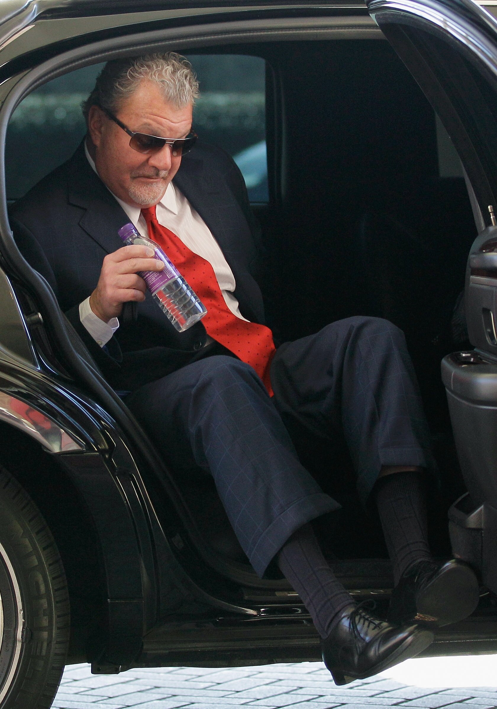 CHANTILLY, VA - MARCH 02: Indianapolis Colts owner Jim Irsay exits a car after arriving for a meeting of NFL owners at a hotel on March 2, 2011 in Chantilly, Virginia. The NFL owners are meeting in Chantilly to discuss negotiations with the players union