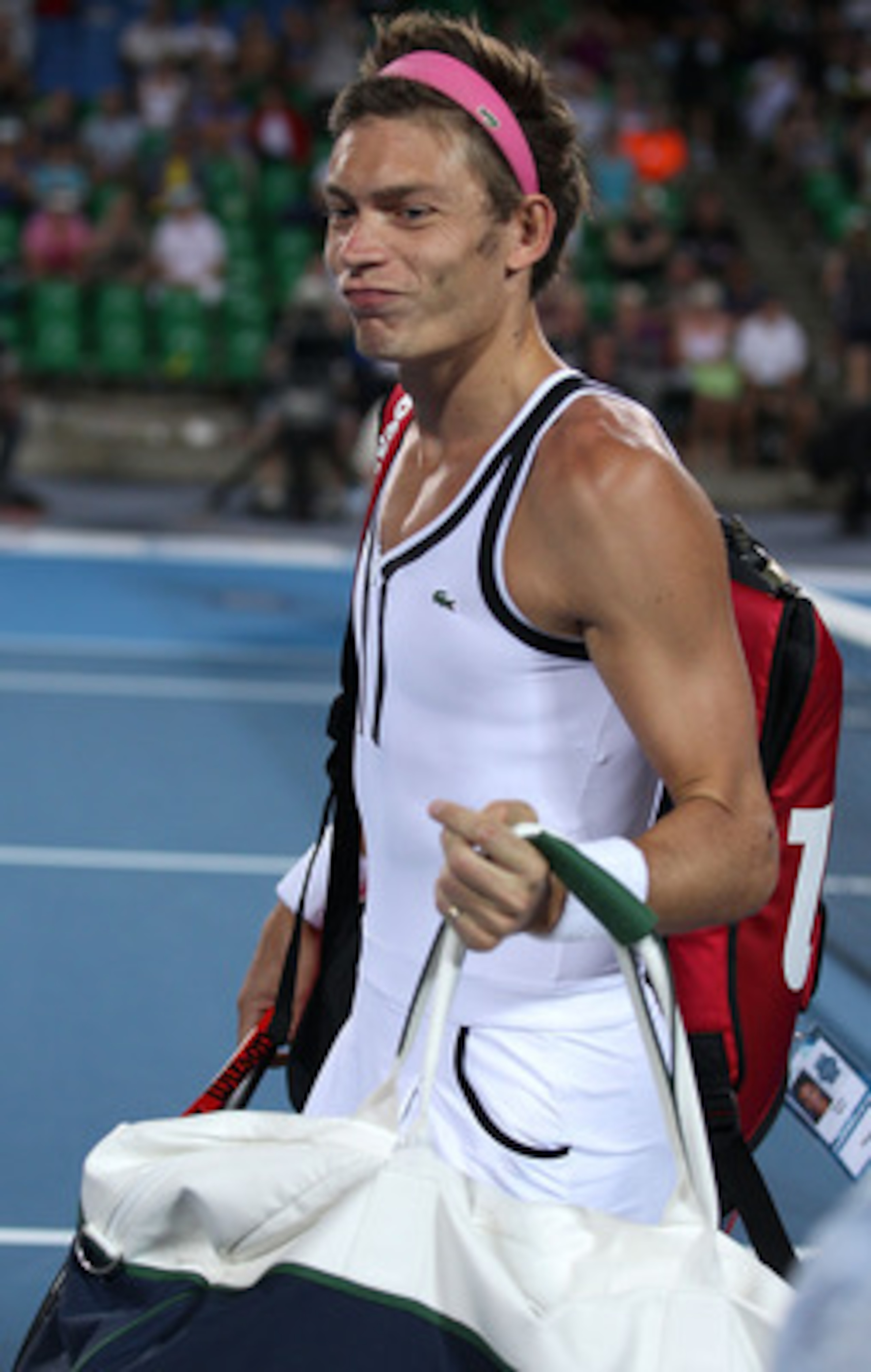 PERTH, AUSTRALIA - JANUARY 07:  Nicolas Mahut of France walks onto the court during an exhibition mixed doubles match against Bethanie Mattek-Sands and John Isner of the USA on day seven of the Hopman Cup on January 7, 2011 in Perth, Australia.  (Photo by