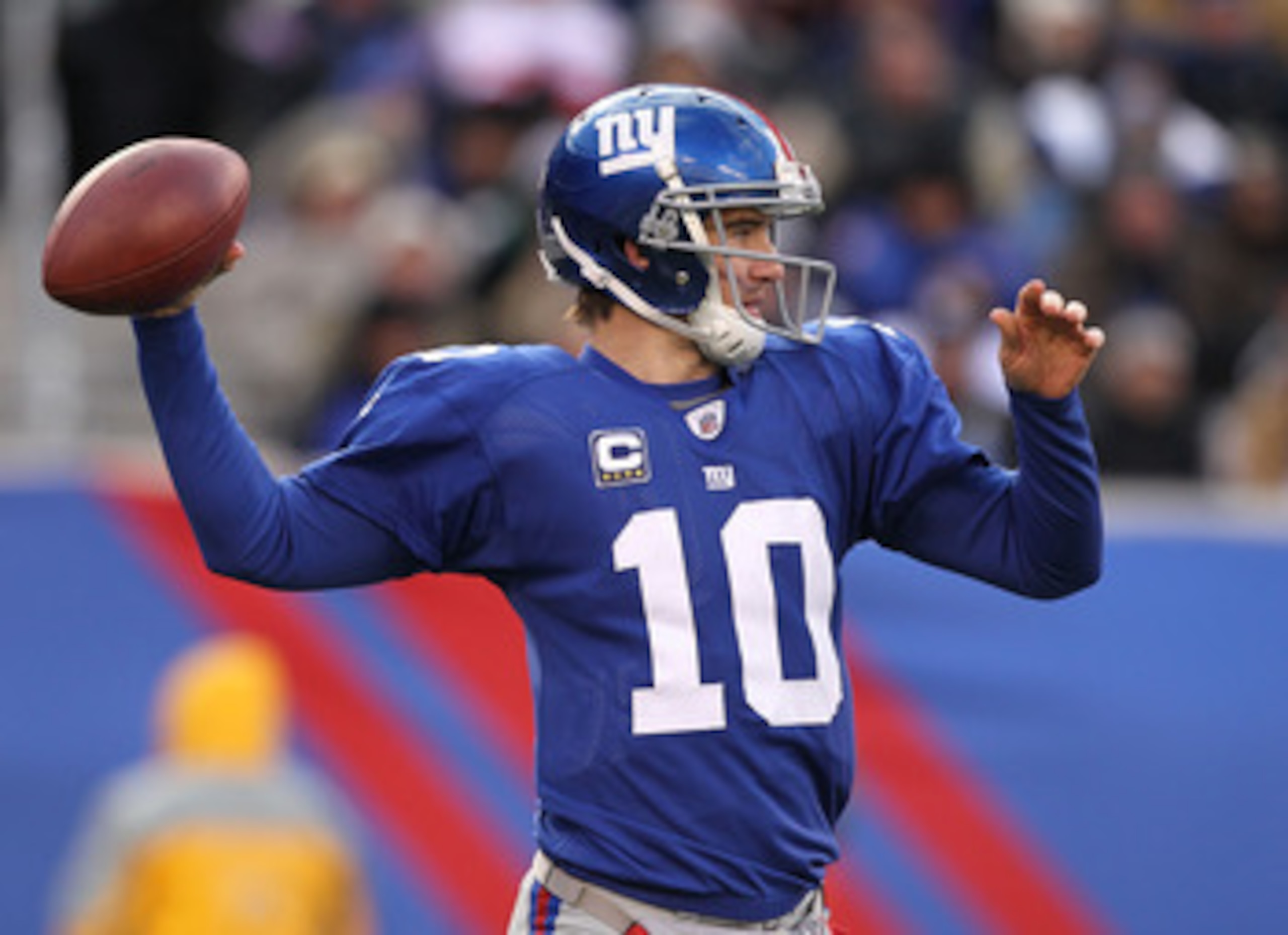 EAST RUTHERFORD, NJ - DECEMBER 05:  Eli Manning #10 of the New York Giants in action against the Washington Redskins during their game on December 5, 2010 at The New Meadowlands Stadium in East Rutherford, New Jersey.  (Photo by Al Bello/Getty Images)