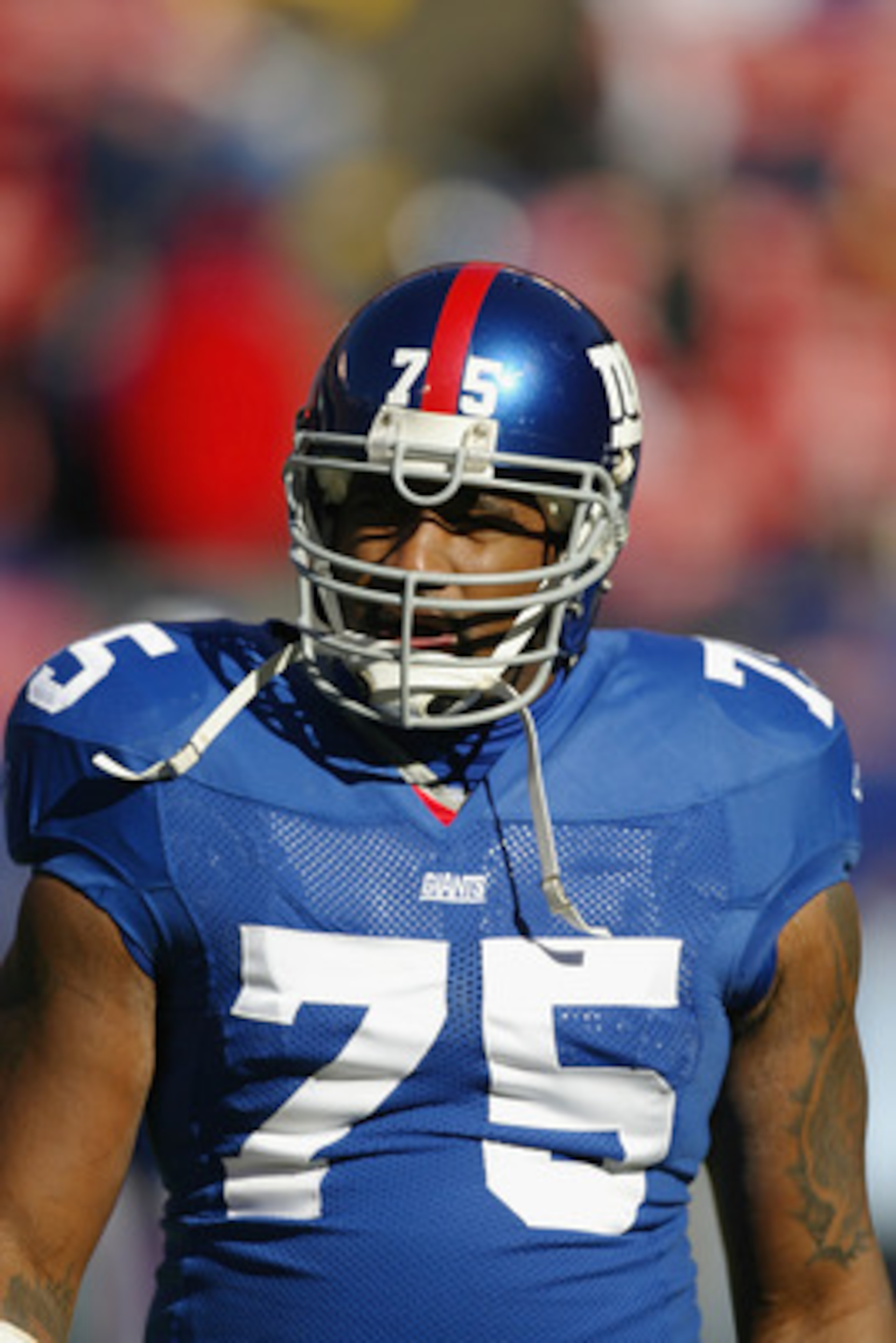 EAST RUTHERFORD, NJ - NOVEMBER 9:  Defensive tackle Keith Hamilton #75 of the New York Giants stands on the field during the game against the Atlanta Falcons at Giant Stadium on November 9, 2003 in East Rutherford, New Jersey. The Falcons defeated the Gia