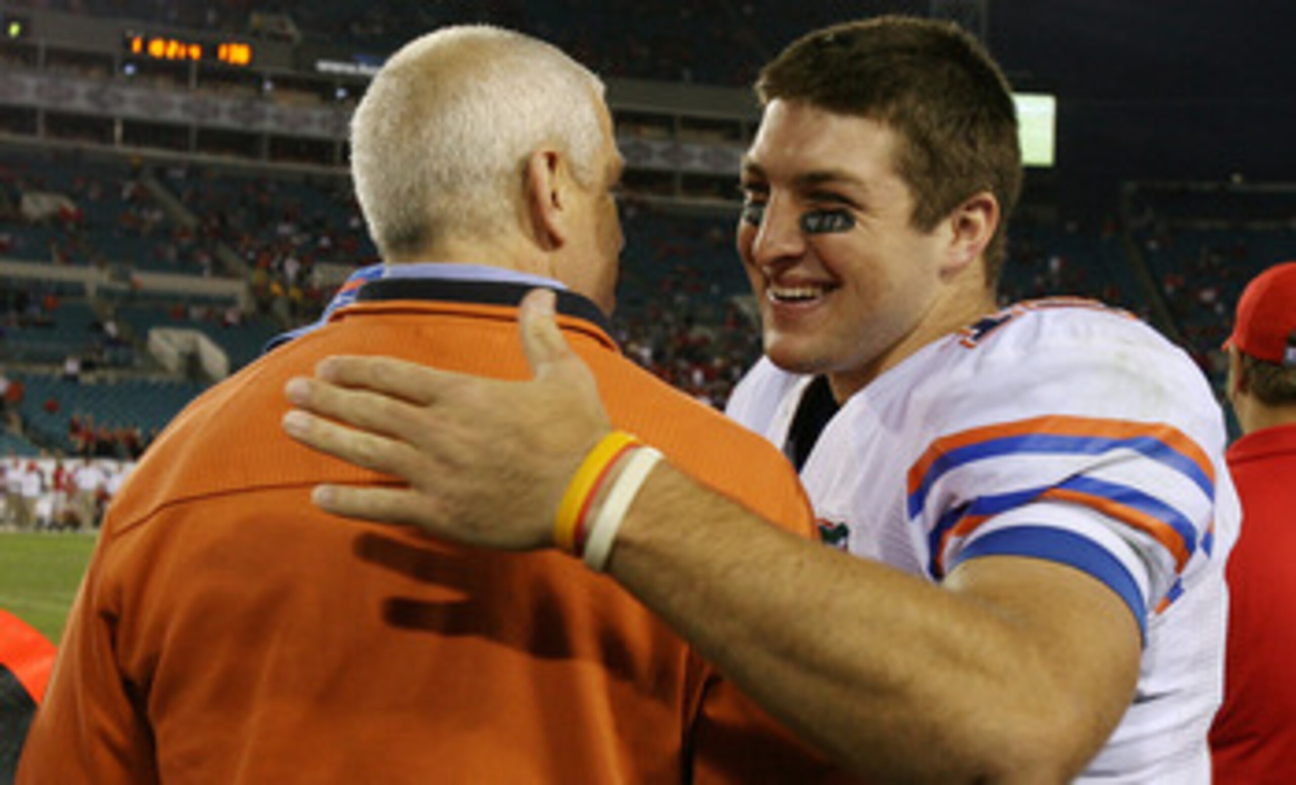 JACKSONVILLE, FL - NOVEMBER 01:  Quarterback Tim Tebow #15 of the Florida Gators hugs athletic director Jeremy Foley late in the fourth quarter against the Georgia Bulldogs at Jacksonville Municipal Stadium on November 1, 2008 in Jacksonville, Florida. Fl