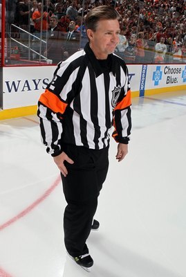 PHILADELPHIA - APRIL 11:  Referee Kerry Fraser #2 looks on during the game between the New York Rangers and the Philadelphia Flyers on April 11, 2010 at Wachovia Center in Philadelphia, Pennsylvania. The game was Fraser's final game in the NHL as he is re
