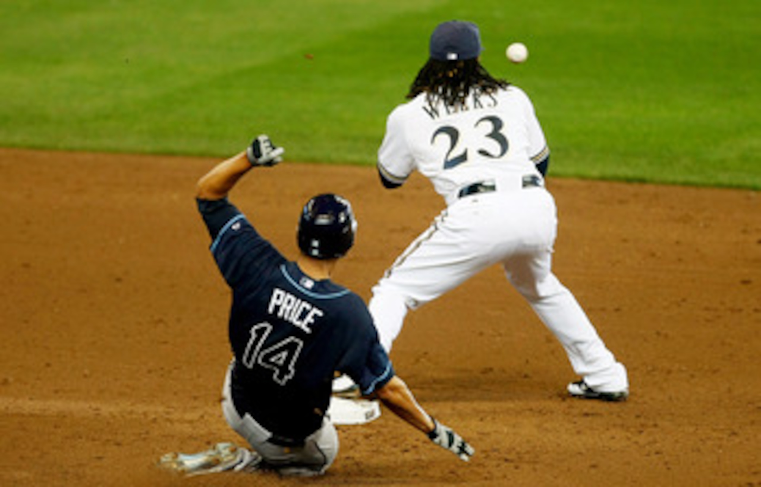MILWAUKEE, WI - JUNE 22: Rickie Weeks #23 of the Milwaukee Brewers catches the baseball for an out at second base as David Price #14 of the Tampa Bay Rays slides at Miller Park on June 22, 2011 in Milwaukee, Wisconsin. (Photo by Scott Boehm/Getty Images)