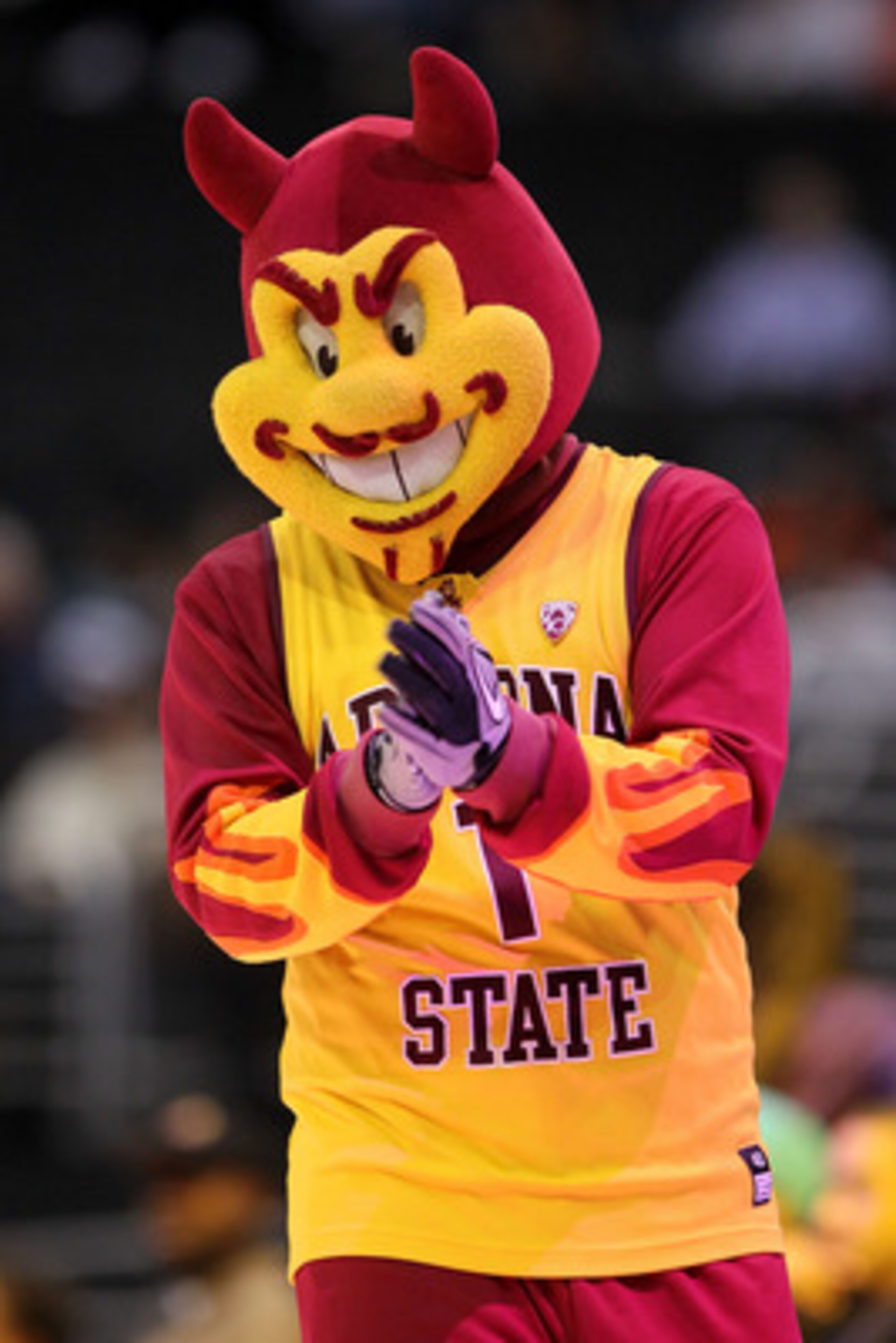 LOS ANGELES, CA - MARCH 09: Sparky, the mascot for the Arizona State Sun Devils, performs on the court during a break in the game between the Sun Devils and the Oregon Ducks in the first round of the 2011 Pacific Life Pac-10 Men's Basketball Tournament a LOS ANGELES, CA - MARCH 09: Sparky, the mascot for the Arizona State Sun Devils, performs on the court during a break in the game between the Sun Devils and the Oregon Ducks in the first round of the 2011 Pacific Life Pac-10 Men's Basketball Tournament a