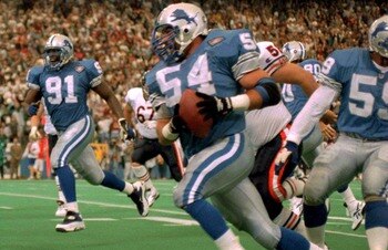 10 NOV 1991:  Chris Spielman, #54, linebacker for the Detroit Lions, tries to evade the block of Tampa Bay Buccaneer tight end Jesse Anderson, #89, during Tampa Bay's 30-21 victory at Tampa Stadium, Tampa Bay, Florida.  MANDATORY CREDIT:  RICK STEWART/
