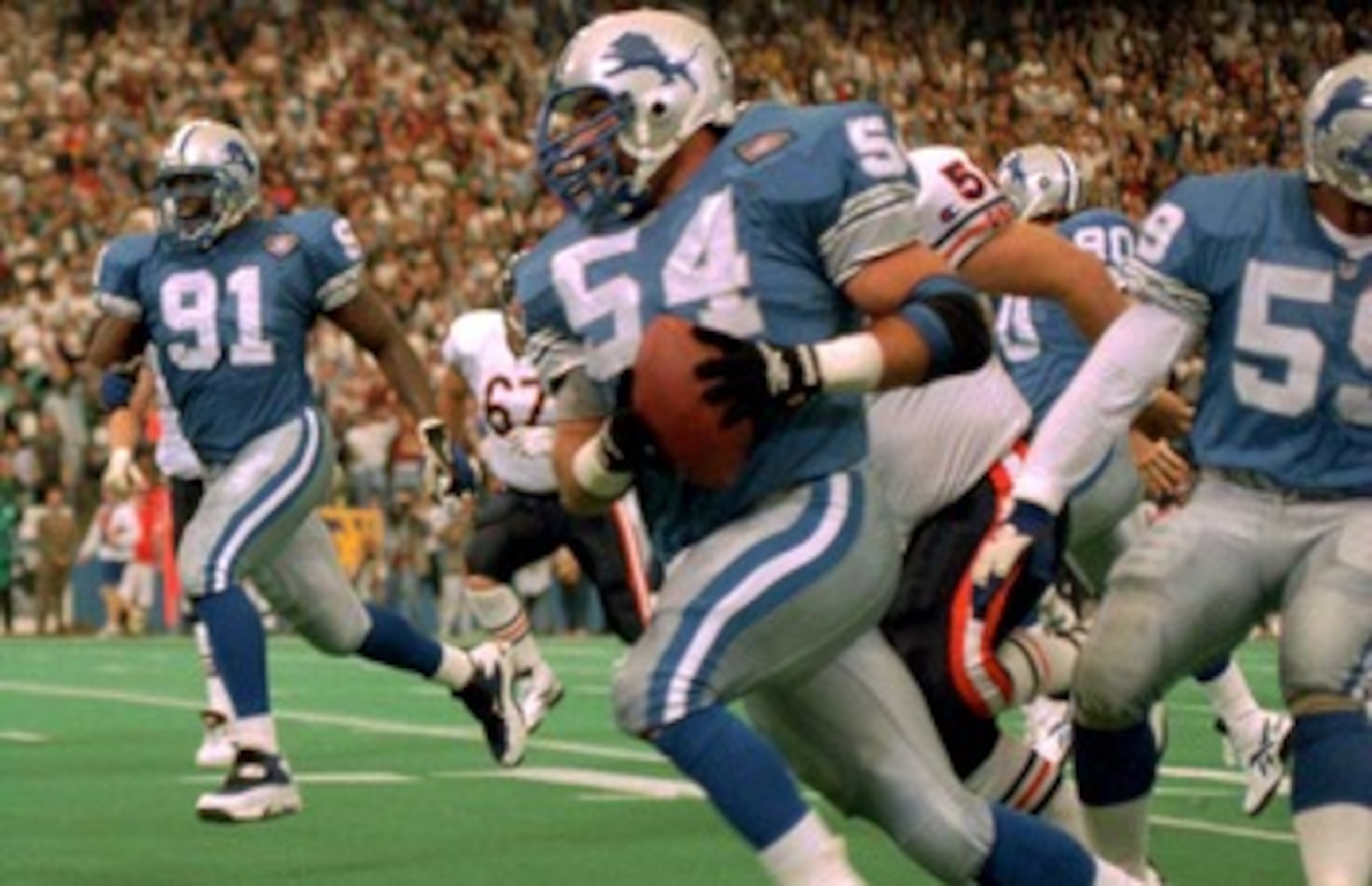 10 NOV 1991:  Chris Spielman, #54, linebacker for the Detroit Lions, tries to evade the block of Tampa Bay Buccaneer tight end Jesse Anderson, #89, during Tampa Bay's 30-21 victory at Tampa Stadium, Tampa Bay, Florida.  MANDATORY CREDIT:  RICK STEWART/