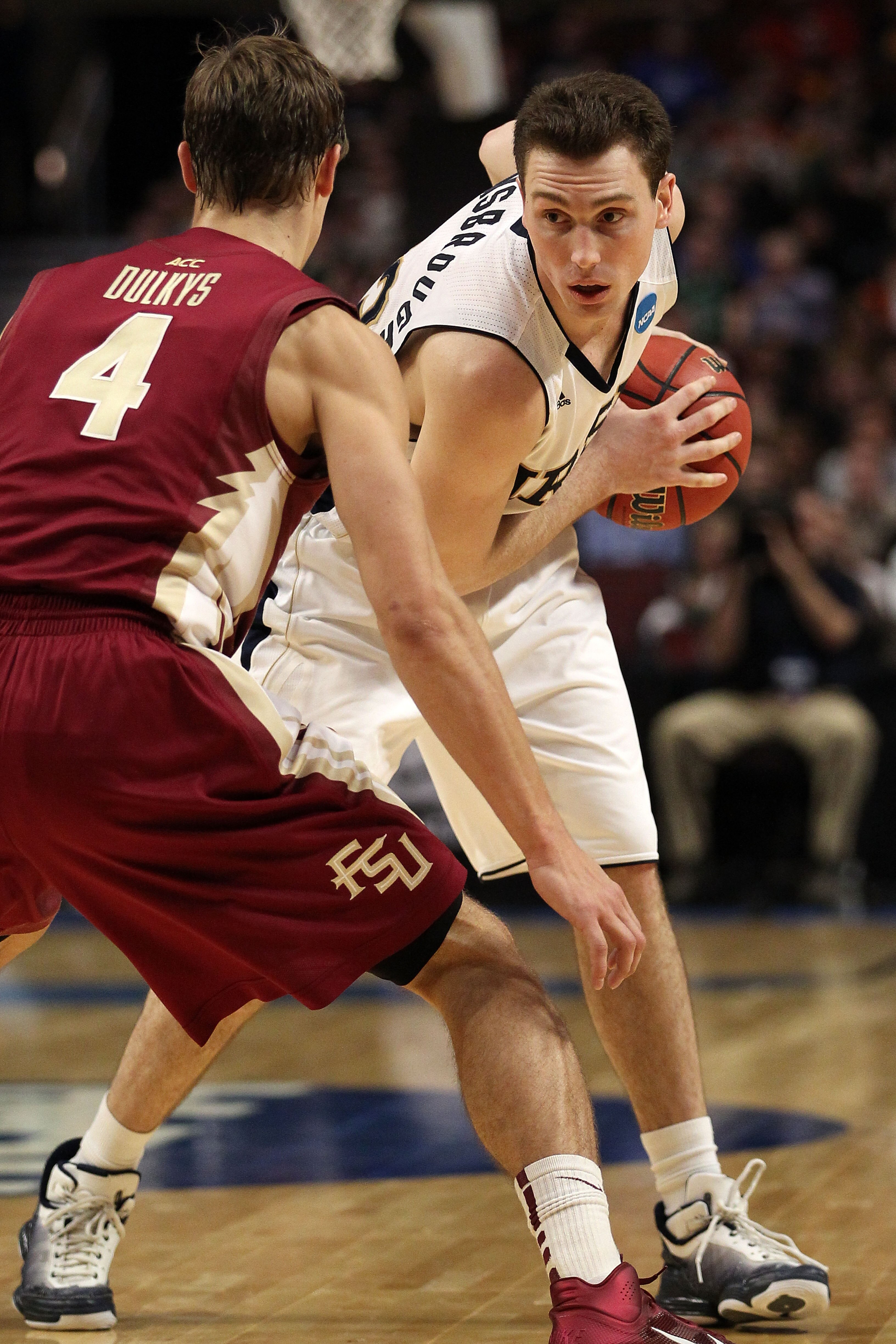 CHICAGO, IL - MARCH 20:  Ben Hansbrough #23 of the Notre Dame Fighting Irish looks to drive against Deividas Dulkys #4 of the Florida State Seminoles in the second half during the third round of the 2011 NCAA men's basketball tournament at the United Cent
